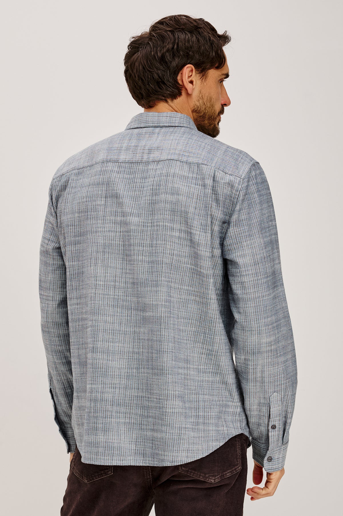Tristan Shirt in 100% Cotton With Rope-Dyed Washed Effect, Collar, Chest Patch Pocket, Front Button Closure, and Long Sleeves in Marine Kelp Stripe Colorway - Upper Body Back View Featured on Model