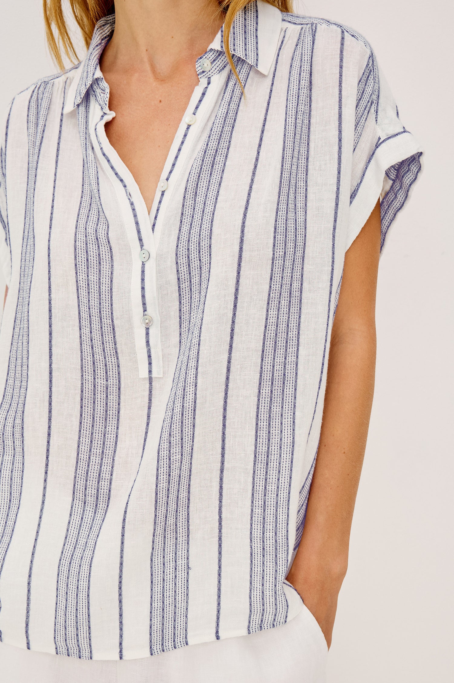 Tuscany Shirt in Linen Blend With Collar, Front Half Placket, Capped Cuff Sleeves, and Slightly-Boxy Fit Fit in Washed Blue Colorway - Upper Body Front View Featured on Model