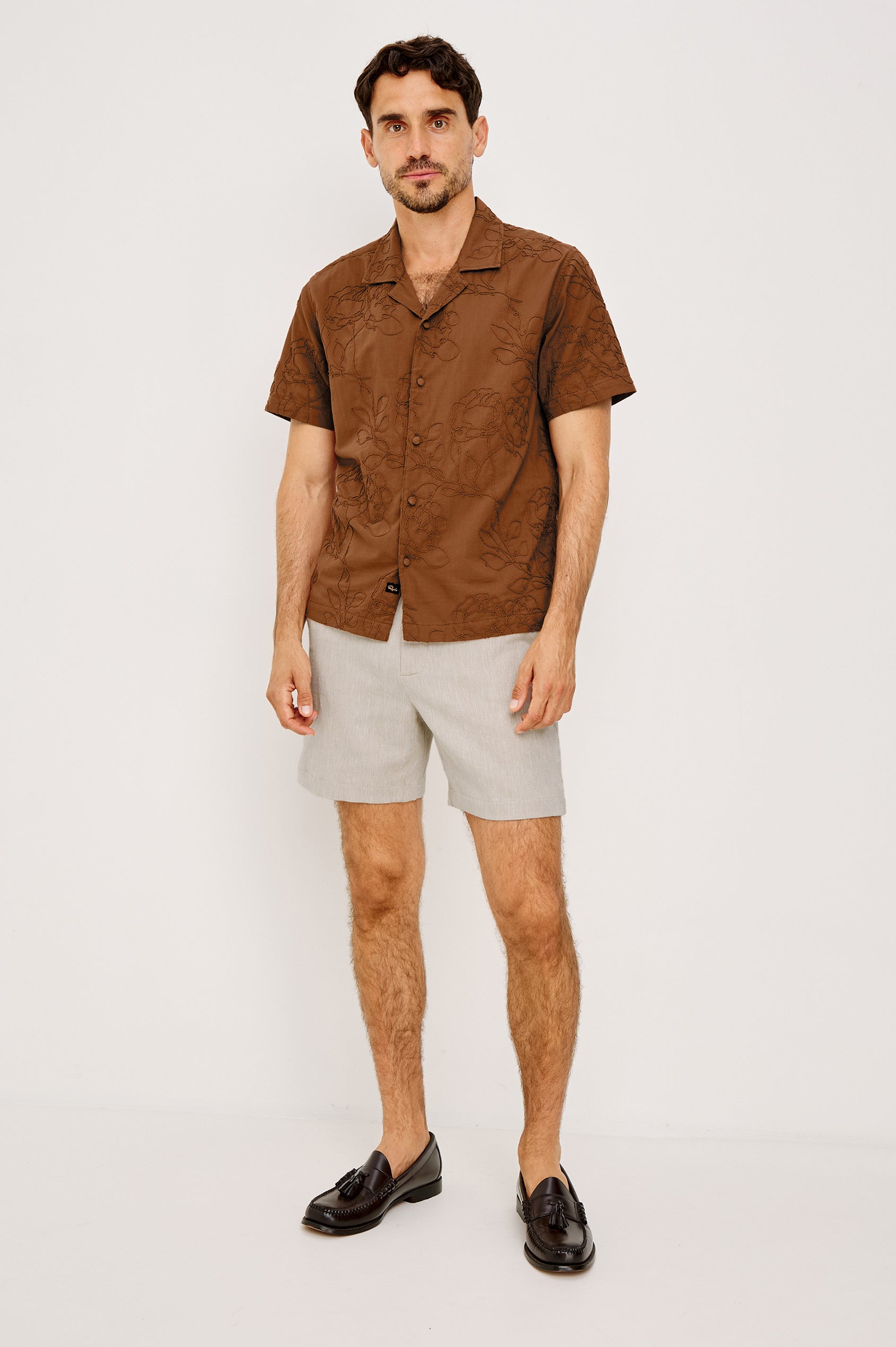 Tyler Shirt in Stretch Cotton With Floral Jute Embroidery, Front Buttons, Notched Collar, Short Sleeves, and Classic Fit in Rope Rust Colorway - Full Body Front View Featured on Model