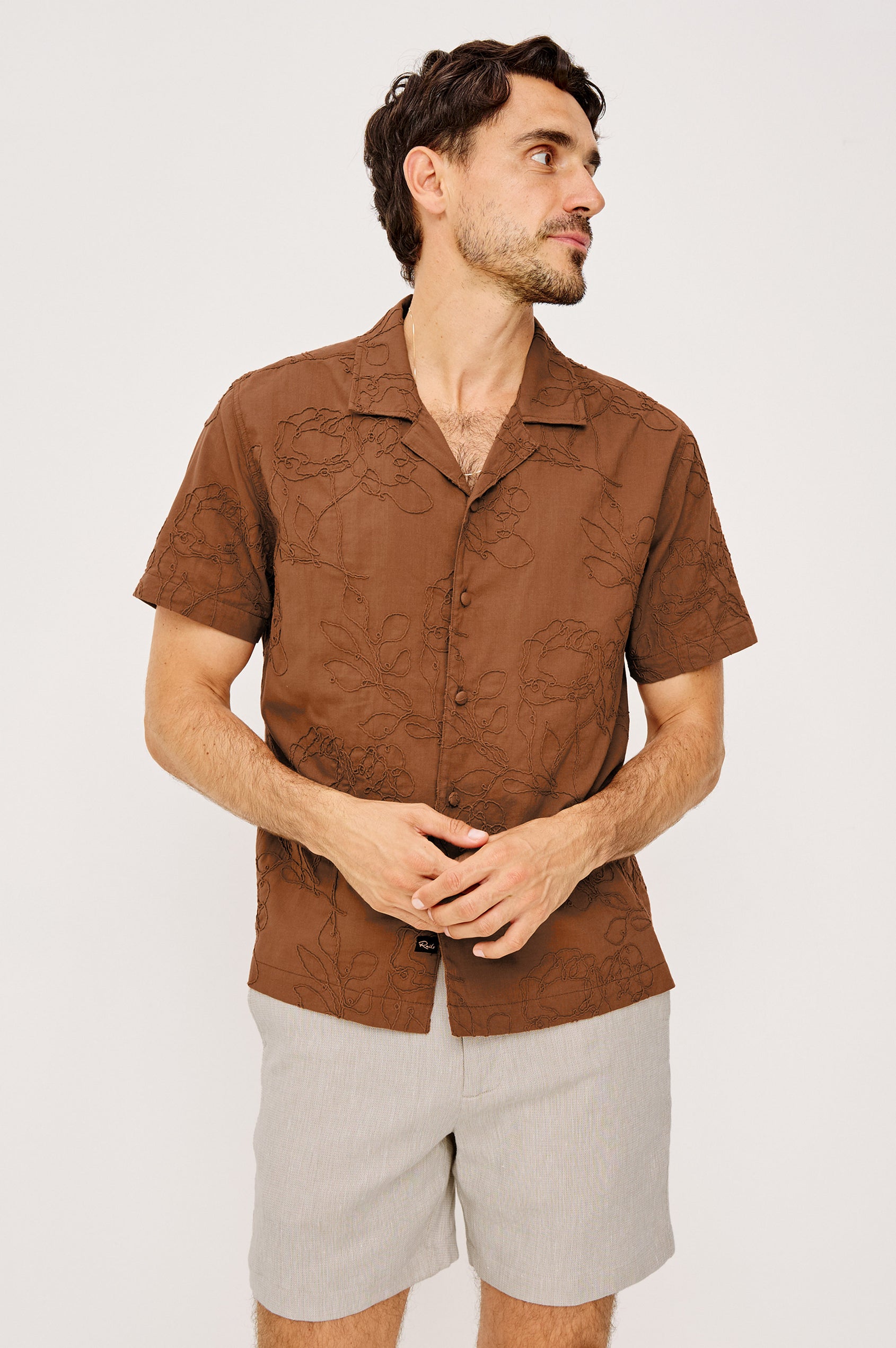 Tyler Shirt in Stretch Cotton With Floral Jute Embroidery, Front Buttons, Notched Collar, Short Sleeves, and Classic Fit in Rope Rust Colorway - Upper Body Front View Featured on Model