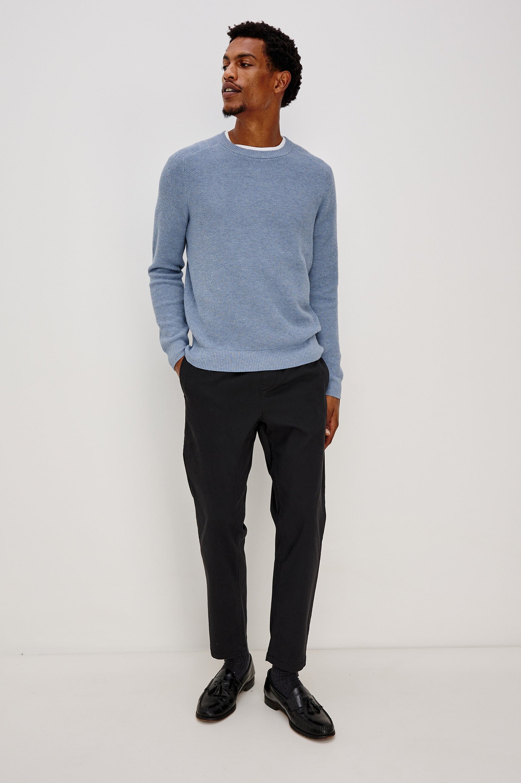 Vann long sleeve crew neck sweater in Light Blue Heather Colorway. Front Full Body View on Model Shown.