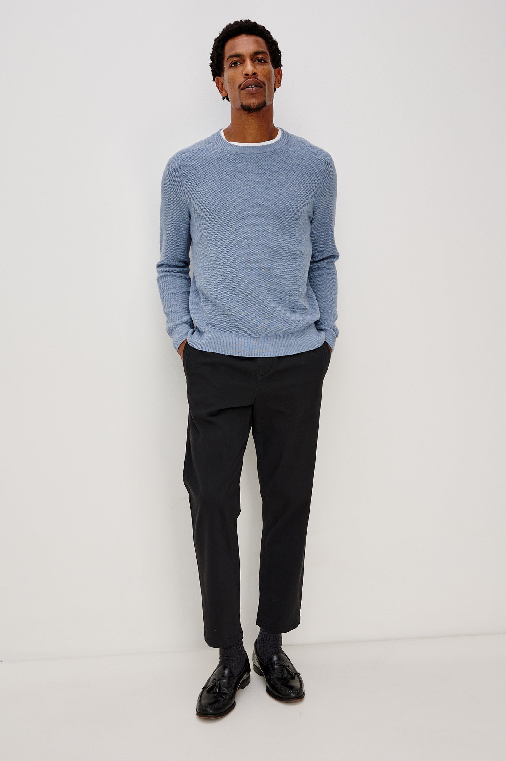 Vann long sleeve crew neck sweater in Light Blue Heather Colorway. Front Full Body View on Model Shown.
