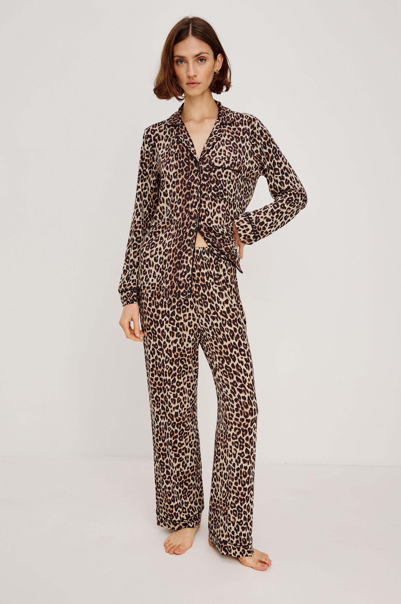 Varra Pajama Set in Jersey With Contrast Piping Button-Up Shirt With Notched Collar and Long Sleeves and Matching High-Waisted Pants With Adjustable Waist Drawstring Ties in Loose Fit in Nala Animal Print Colorway - Full Body Front View Featured on Model