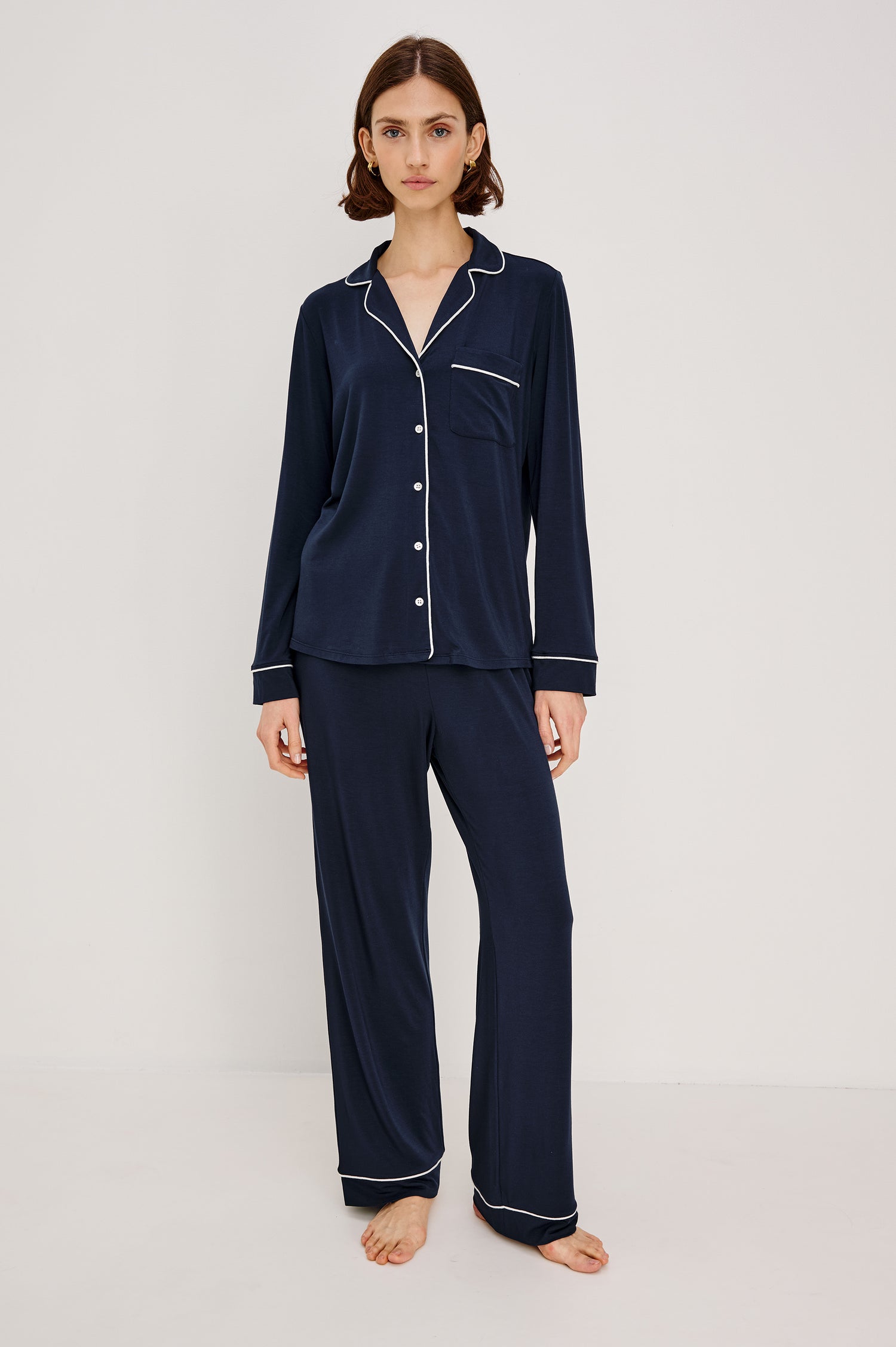 Varra Pajama Set in Jersey With Contrast Piping Button-Up Shirt With Notched Collar and Long Sleeves and Matching High-Waisted Pants With Adjustable Waist Drawstring Ties in Loose Fit in Navy Colorway - Full Body Front View Featured on Model