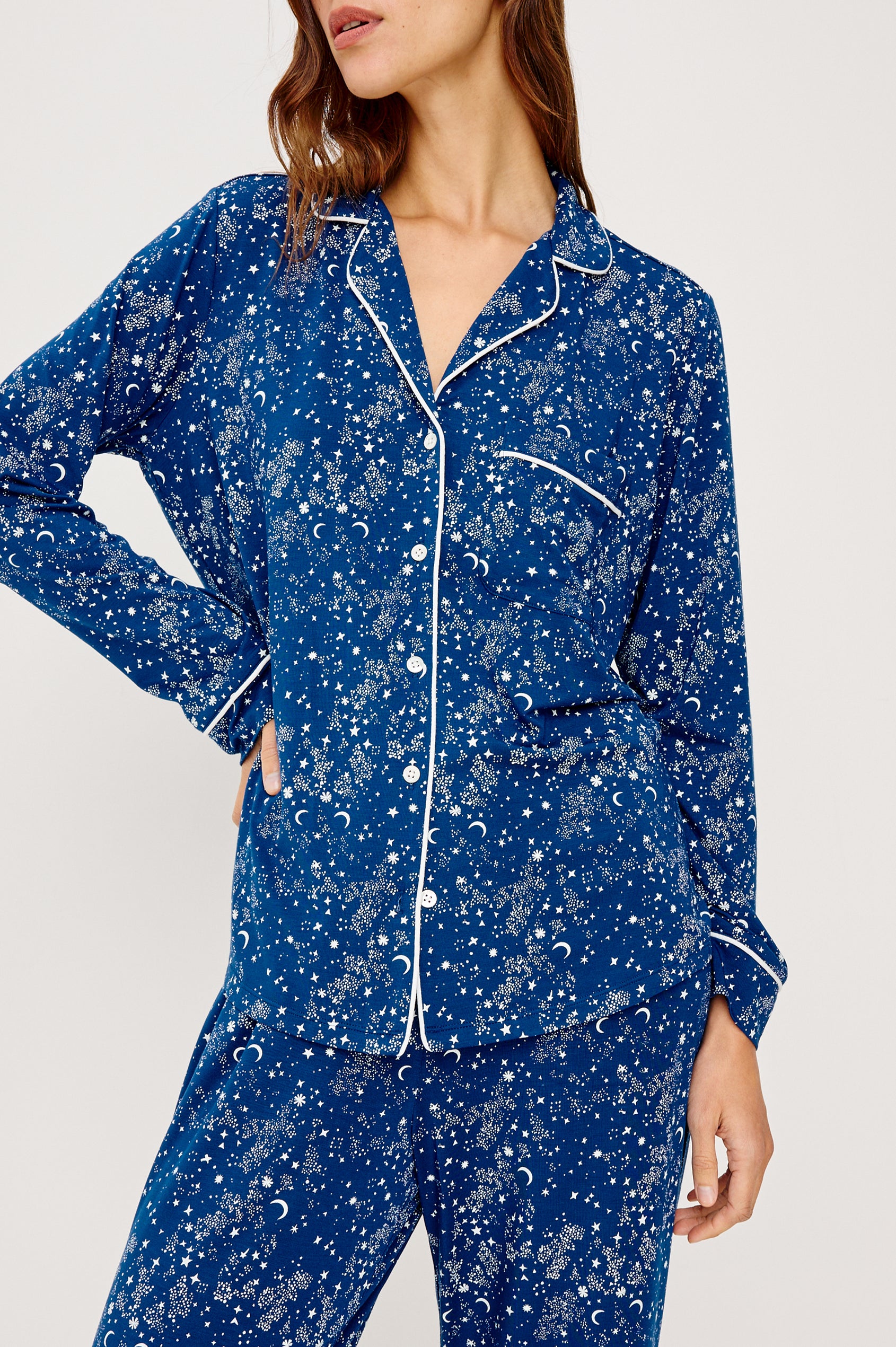 Varra Pajama Set in Jersey With Contrast Piping Button-Up Shirt With Notched Collar and Long Sleeves and Matching High-Waisted Pants With Adjustable Waist Drawstring Ties in Loose Fit in Starry Night Colorway - Upper Body Close Up Front View Featured on Model