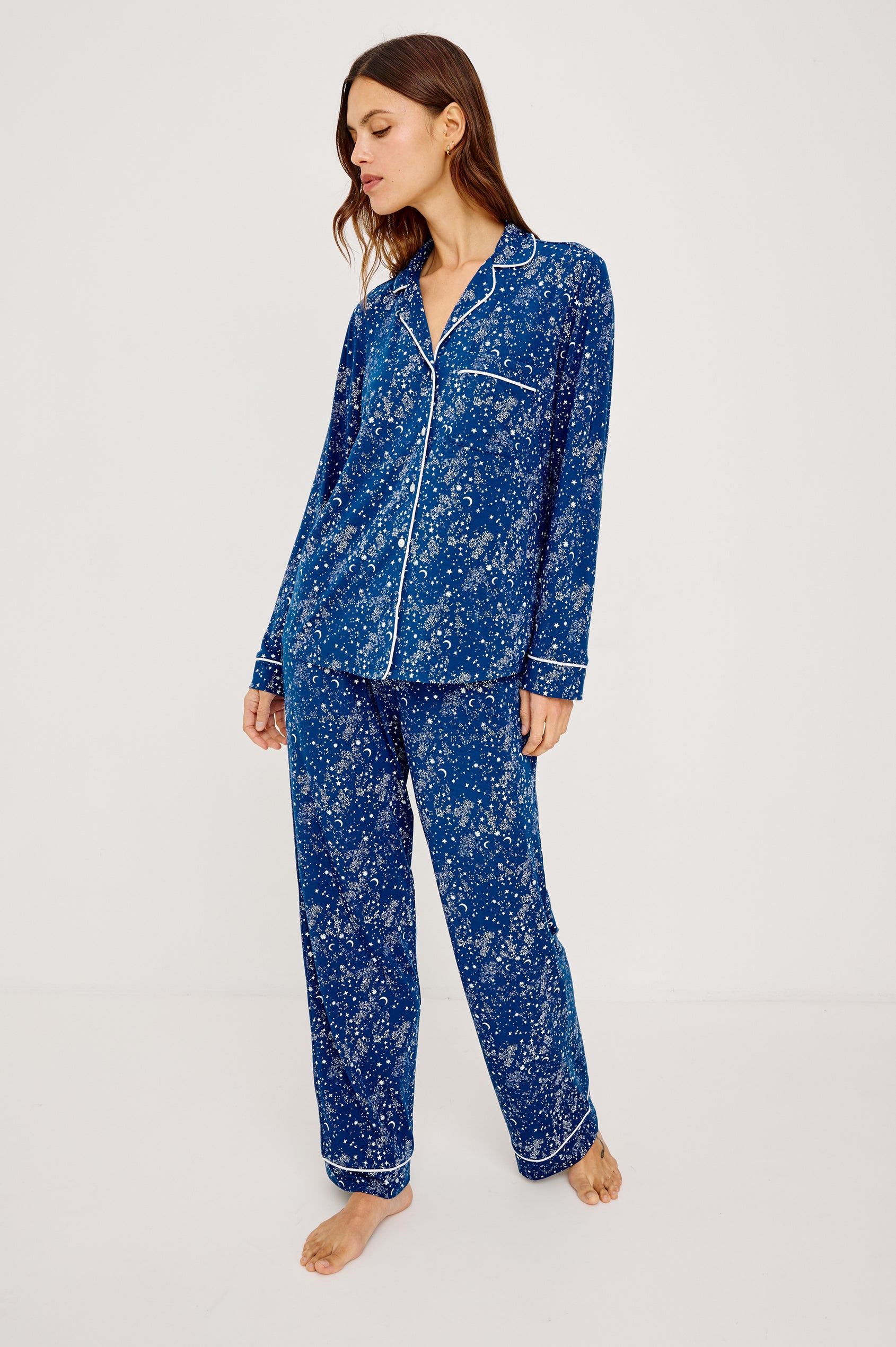 Varra Pajama Set in Jersey With Contrast Piping Button-Up Shirt With Notched Collar and Long Sleeves and Matching High-Waisted Pants With Adjustable Waist Drawstring Ties in Loose Fit in Starry Night Colorway - Full Body Front View Featured on Model
