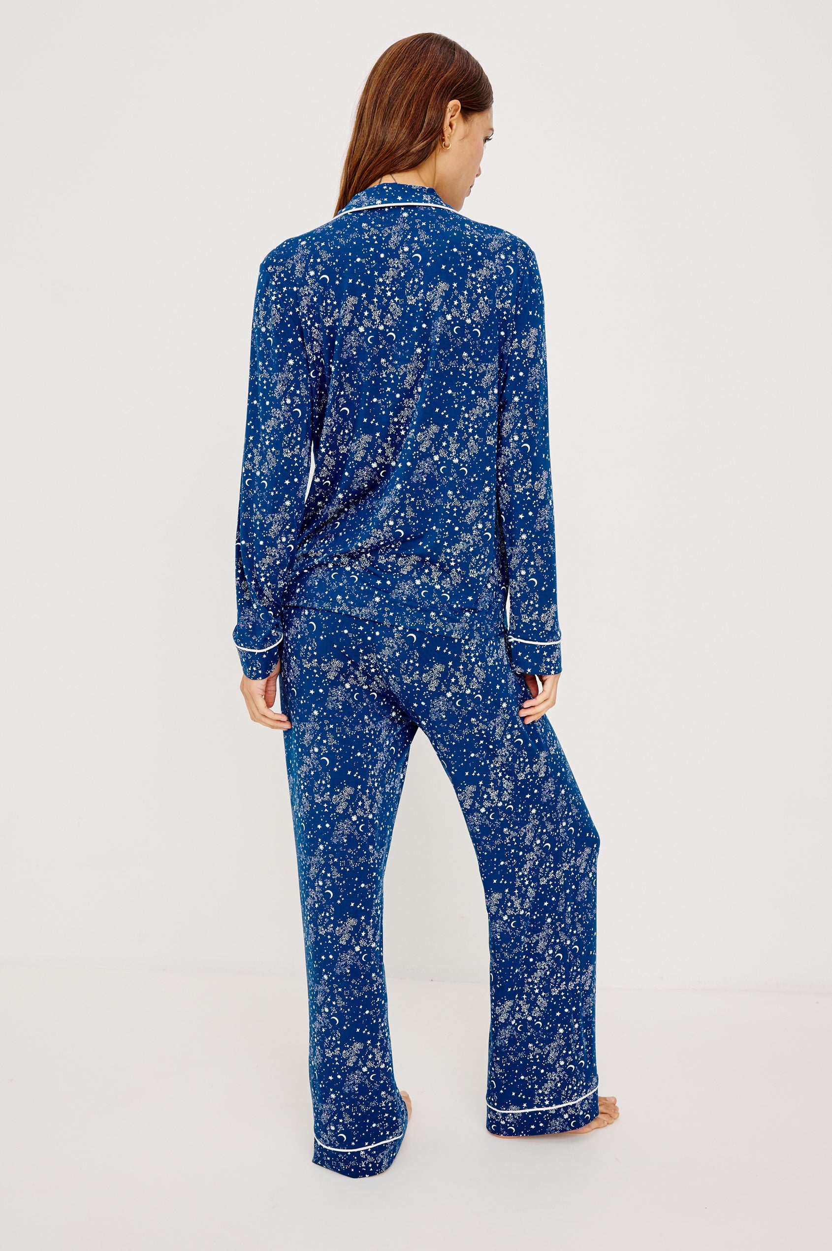 Varra Pajama Set in Jersey With Contrast Piping Button-Up Shirt With Notched Collar and Long Sleeves and Matching High-Waisted Pants With Adjustable Waist Drawstring Ties in Loose Fit in Starry Night Colorway - Full Body Front View Featured on Model