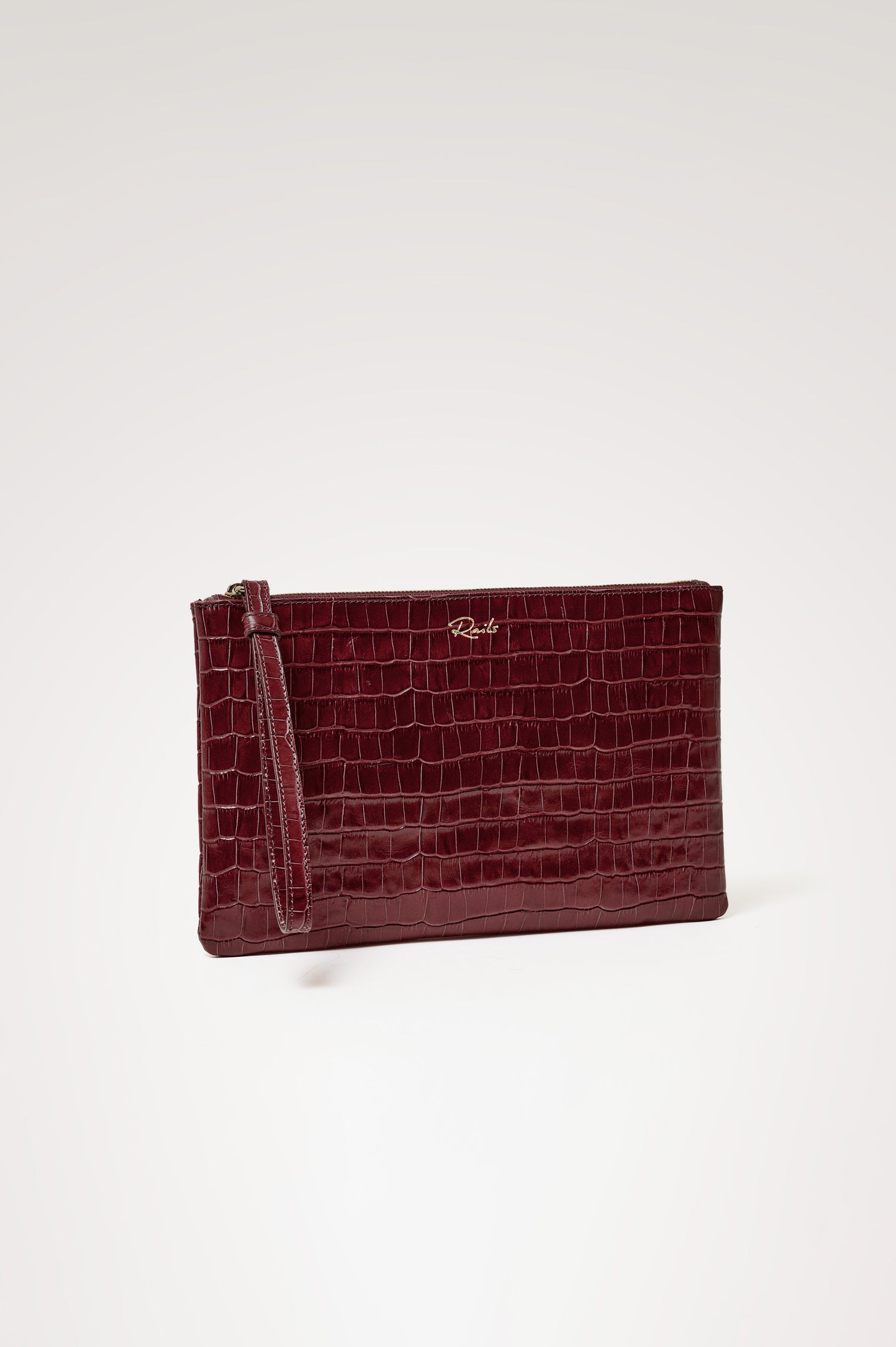 Verona Clutch Bag in Croc-Embossed Leather With Attached Wristlet Strap, Top Zip Closure, and Interior Slip Pocket in Burgundy Croc Embossed Colorway - Front Product View Featured