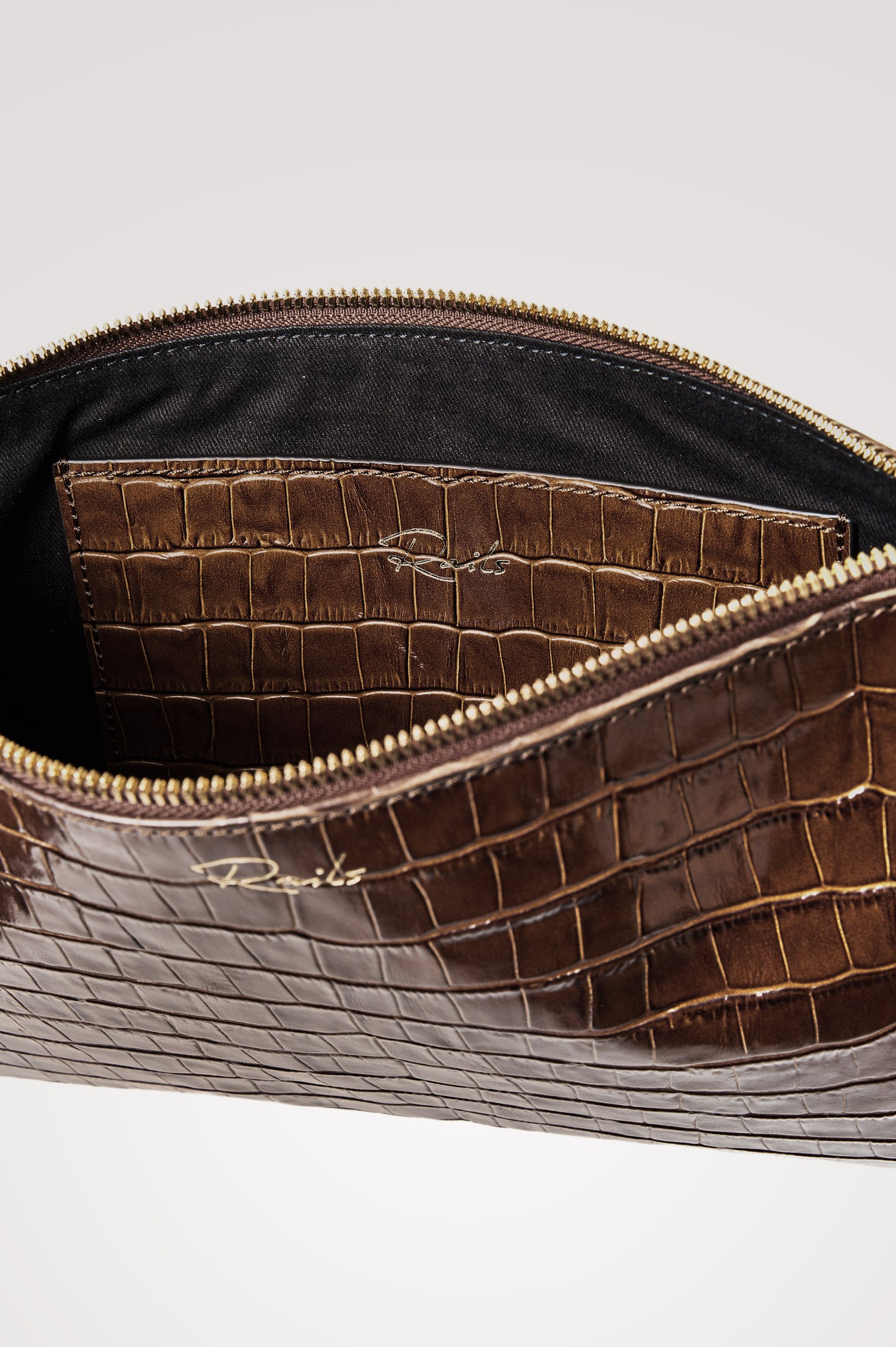 Verona Clutch Bag in Croc-Embossed Leather With Attached Wristlet Strap, Top Zip Closure, and Interior Slip Pocket in Brown Croc Embossed Colorway - Top Close Up Product View Featured