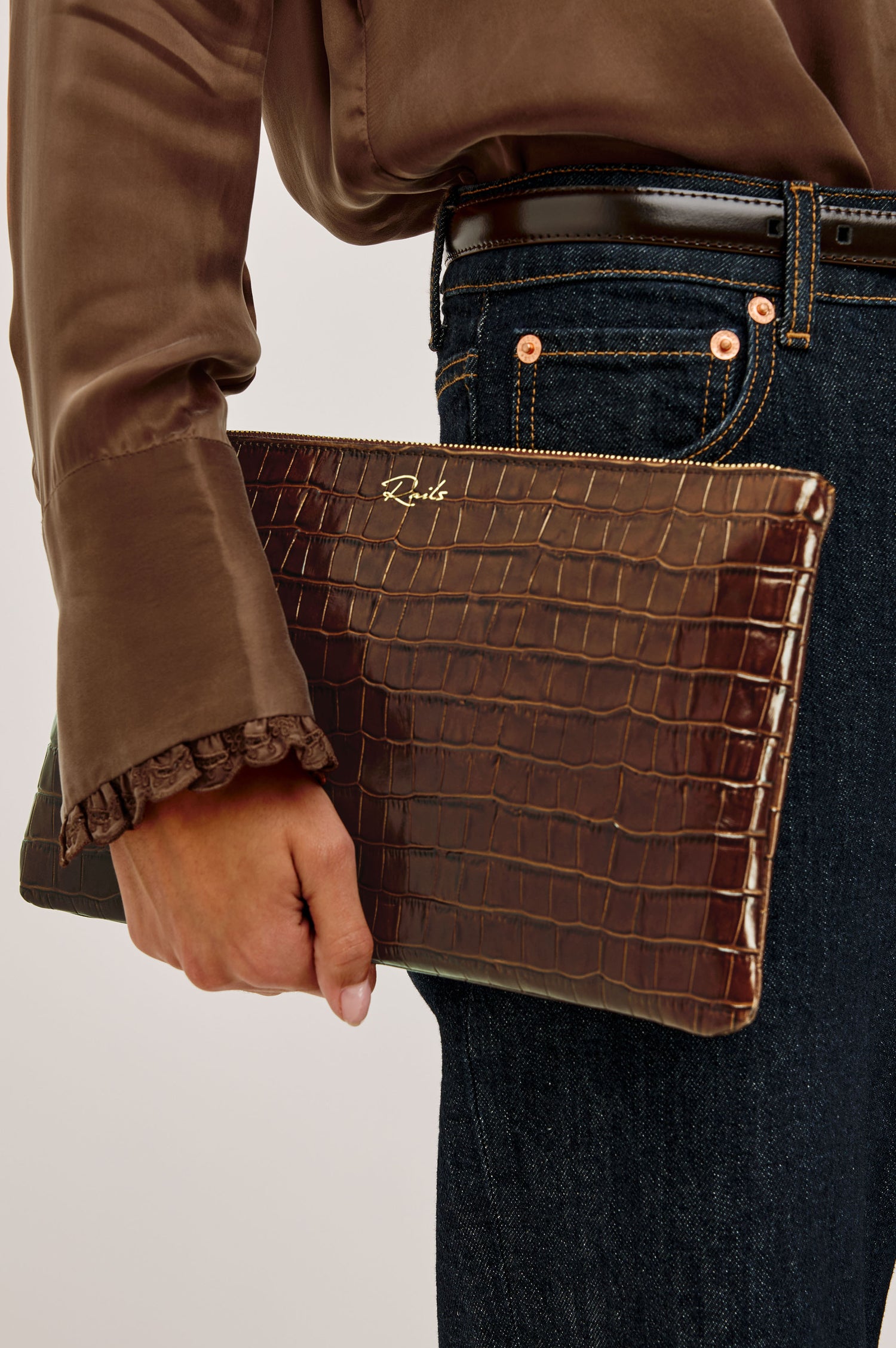 Verona Clutch Bag in Croc-Embossed Leather With Attached Wristlet Strap, Top Zip Closure, and Interior Slip Pocket in Brown Croc Embossed Colorway - Top Close Up Product View Featured