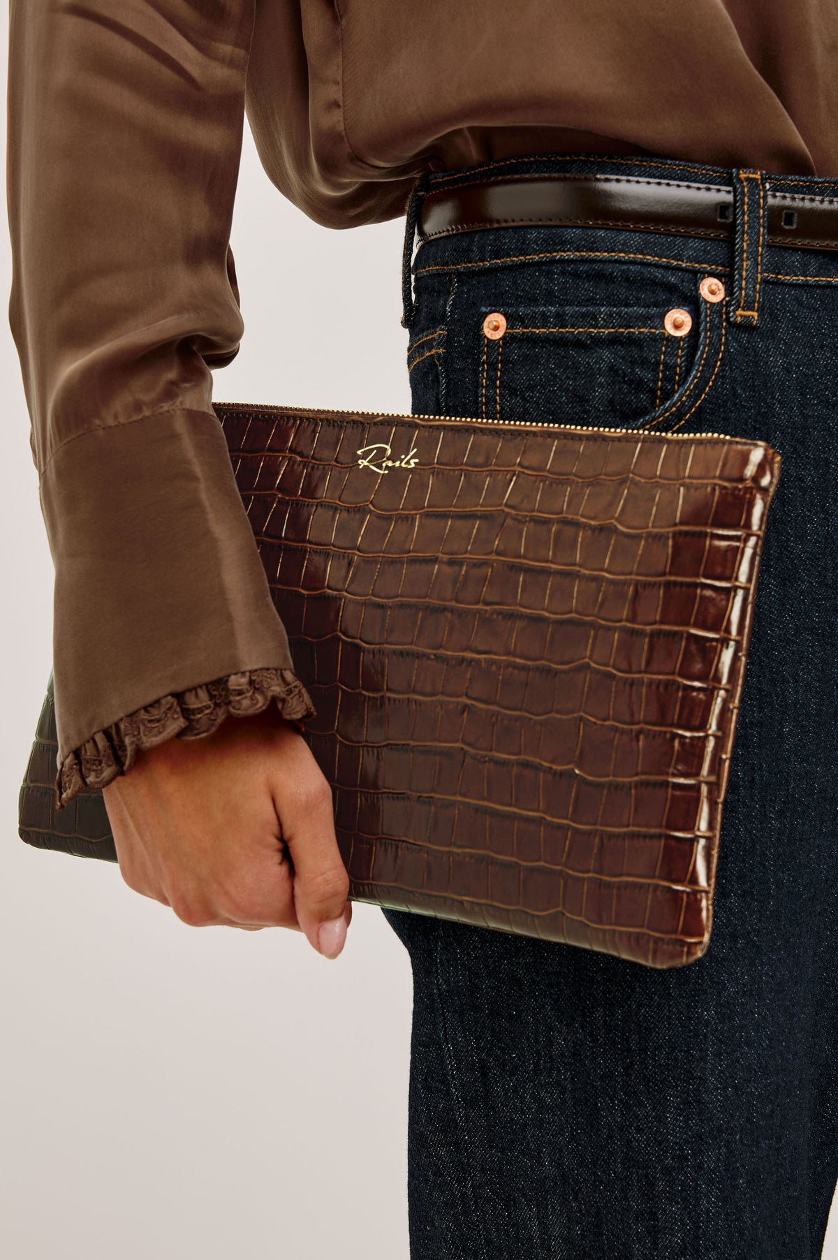 Verona Clutch Bag in Croc-Embossed Leather With Attached Wristlet Strap, Top Zip Closure, and Interior Slip Pocket in Brown Croc Embossed Colorway - Top Close Up Product View Featured