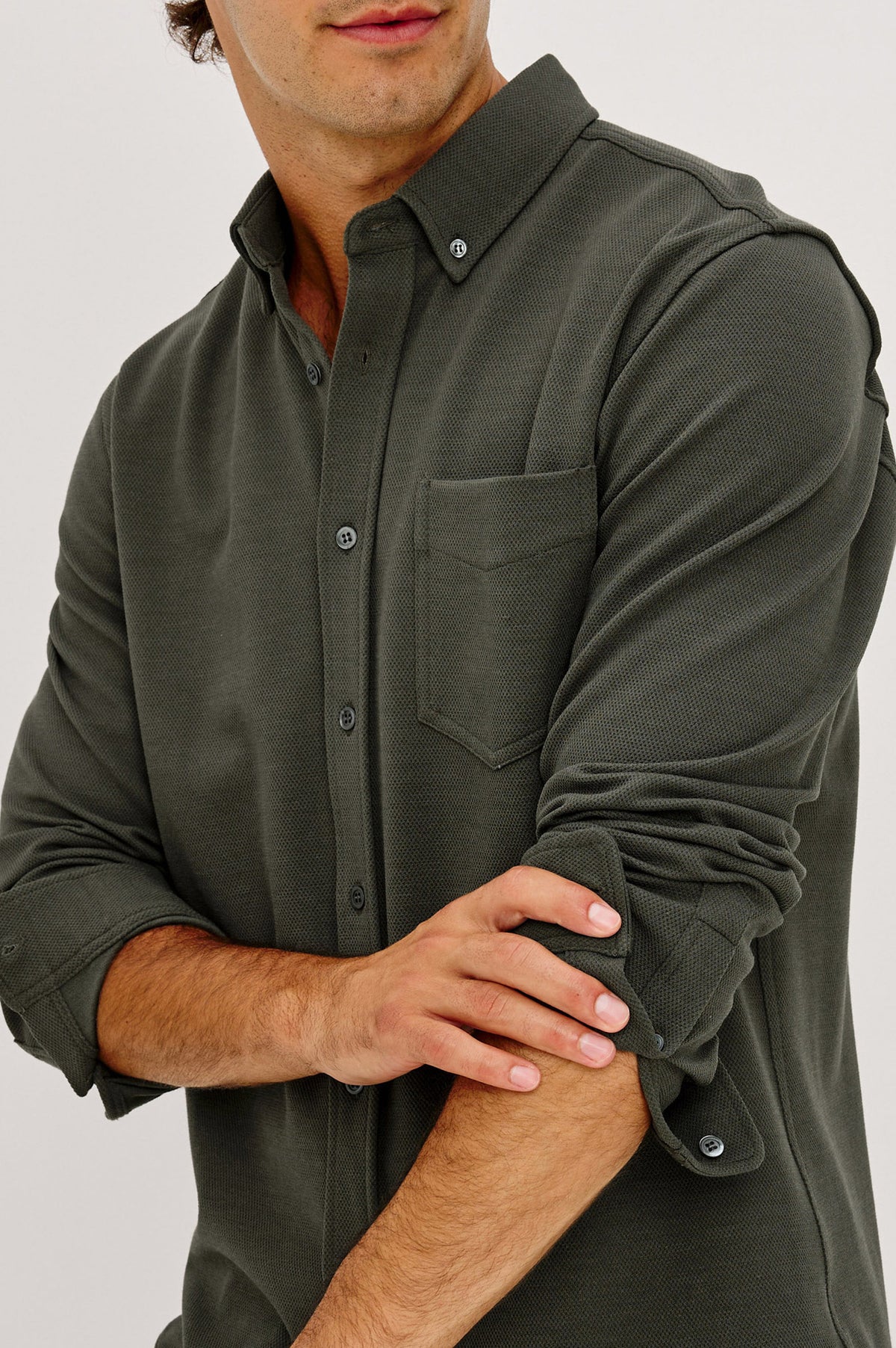 Vincent is a Collared Long Sleeve Button Front Shirt with a Chest Pocket in Hunter Green Colorway - Upper Body Front Detail View Featured on Model.