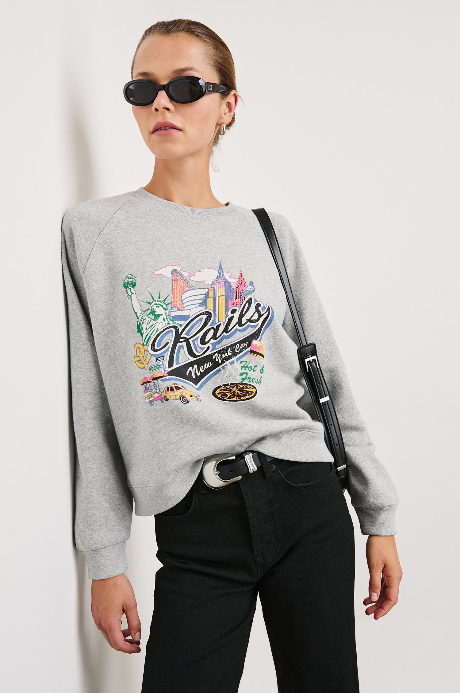 Vintage Raglan Long-Sleeve Sweatshirt with a Crew Neck, an image of landmarks in Los Angeles and the Text, Rails New York City, Hot and Fresh in Rails New York Colorway, Multi Colored on Grey - Front View Featured on Model