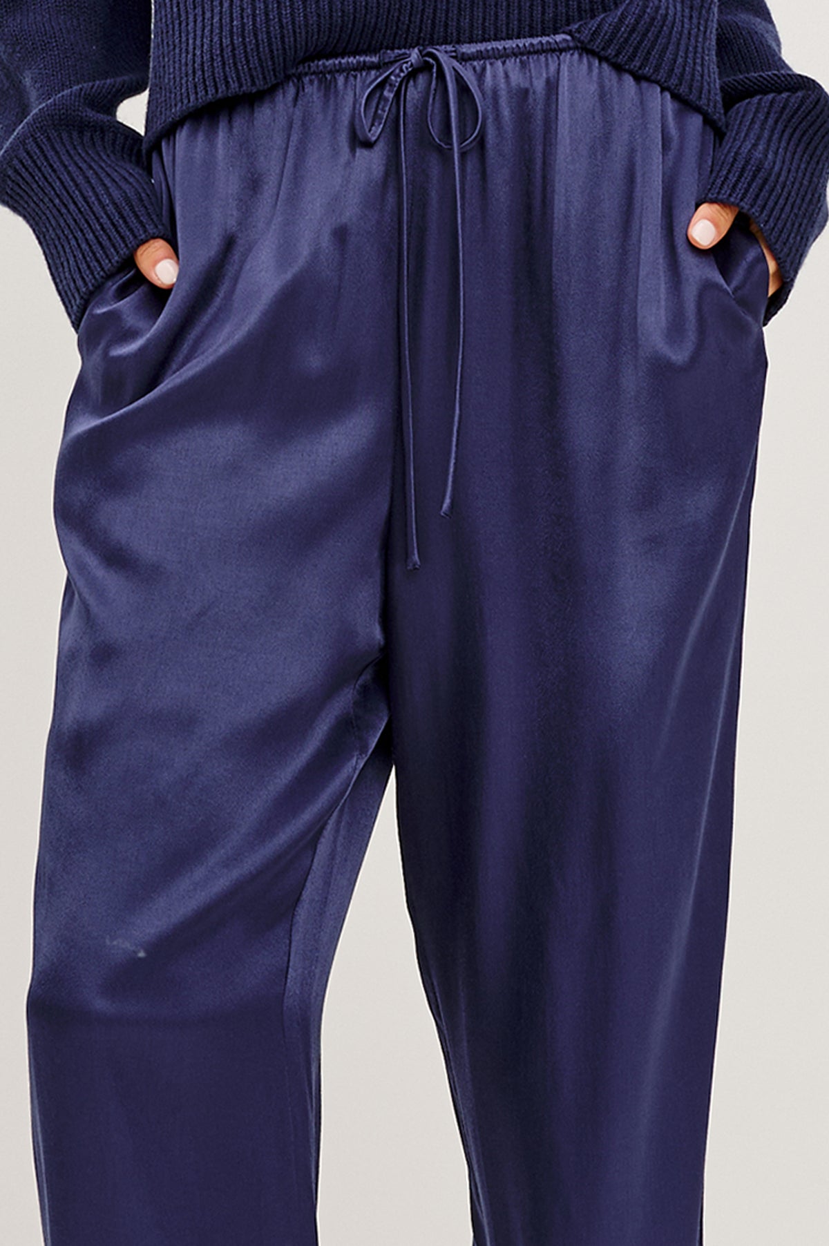 Virgo Pant in Satin-Back Crepe With Srtaight Legs, Drawstring Waist, and Side-Seam Pockets in Navy Colorway - Lower Body Close Up View Featured on Model