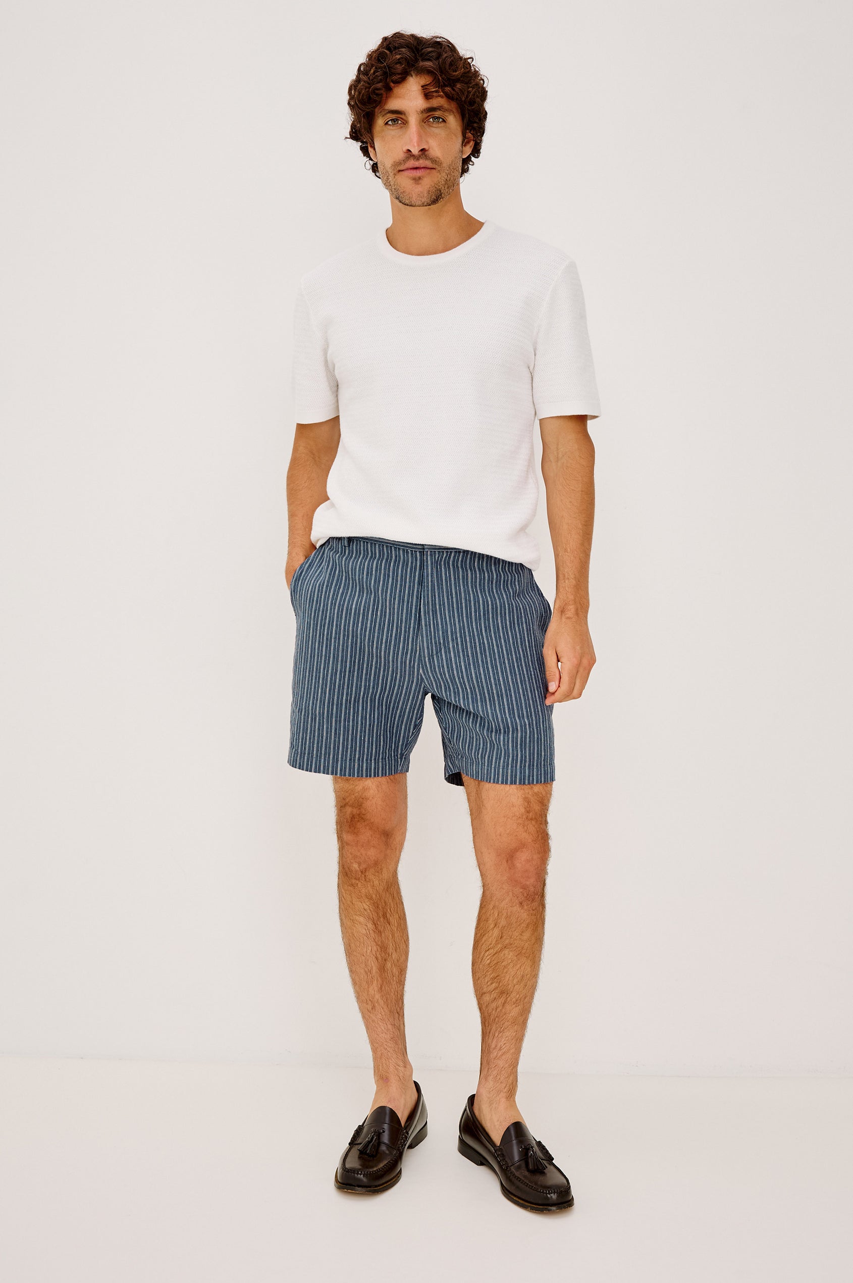 Wilson Short in Linen With a Straight Fit, Clean Front Waistband, Elasticated Back, Front Zip Fly, and Side Pockets in Navy Multi Stripe Colorway - Full Body Front View Featured on Model