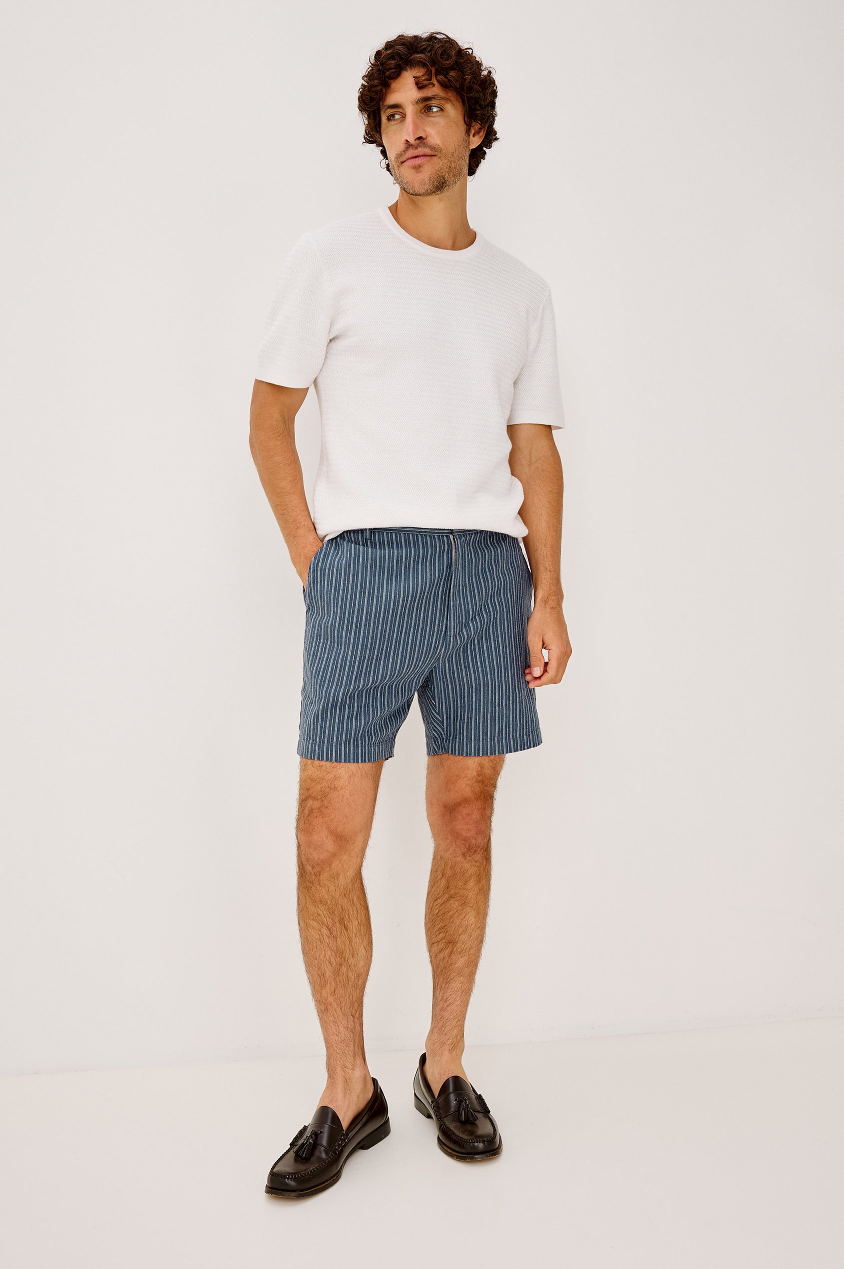 Wilson Short in Linen With a Straight Fit, Clean Front Waistband, Elasticated Back, Front Zip Fly, and Side Pockets in Navy Multi Stripe Colorway - Full Body Front View Featured on Model