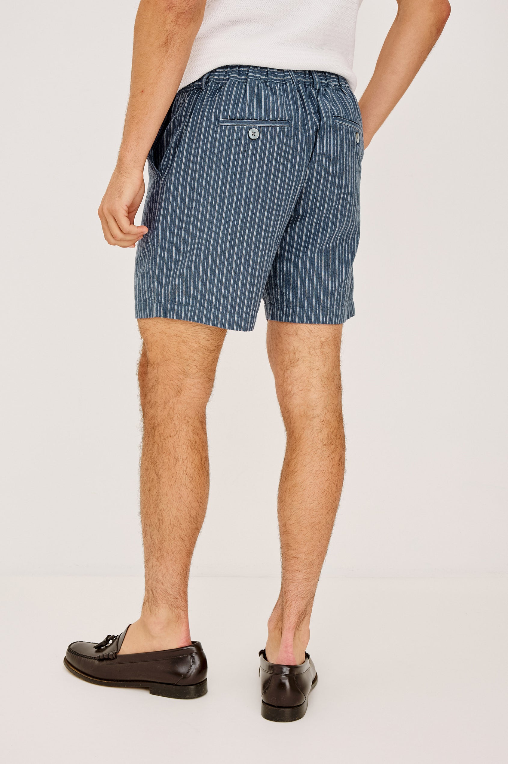 Wilson Short in Linen With a Straight Fit, Clean Front Waistband, Elasticated Back, Front Zip Fly, and Side Pockets in Navy Multi Stripe Colorway - Lower Body Back View Featured on Model