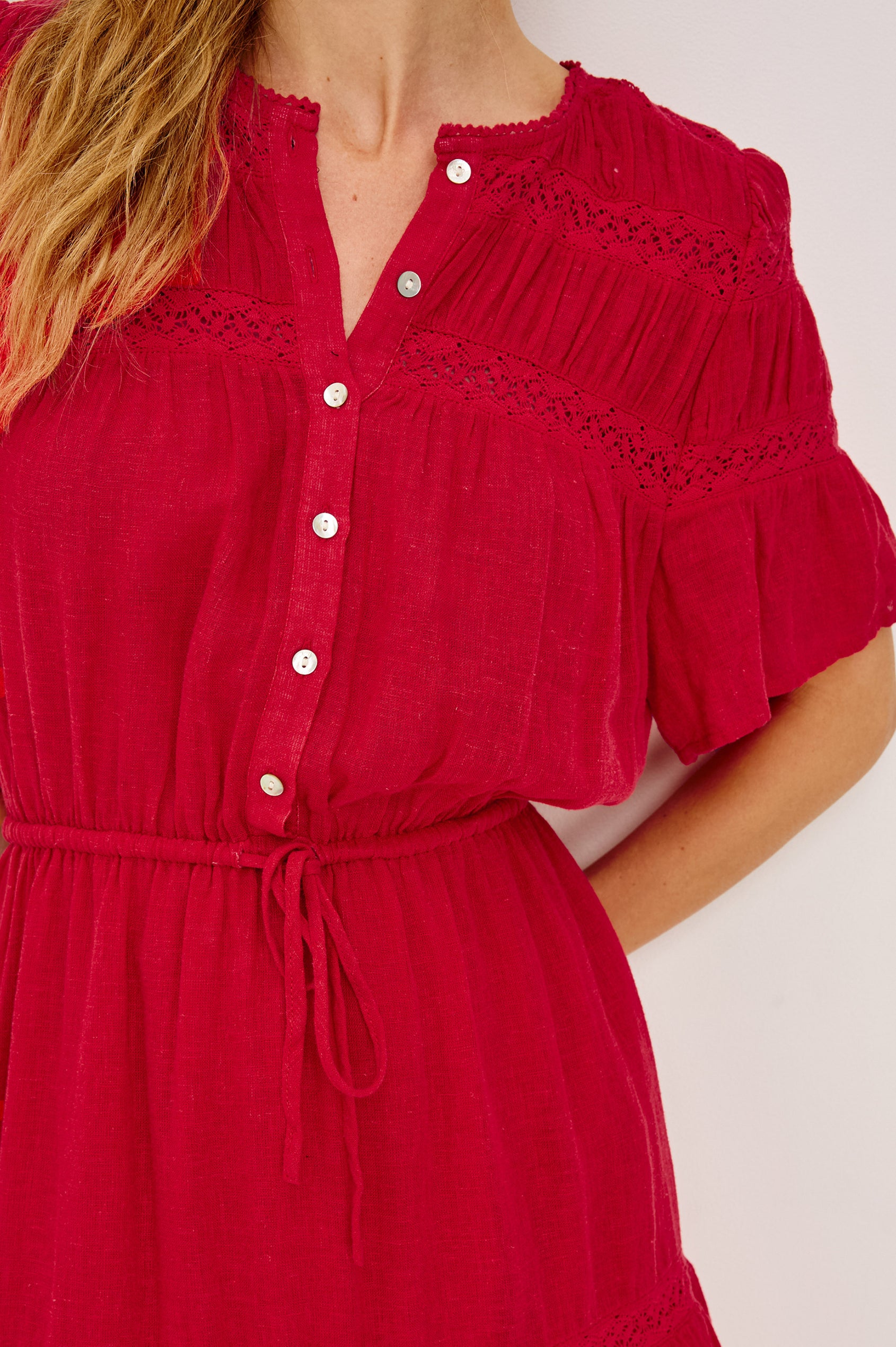 Winslow Mini Dress in Luxe Linen With Loose Fit, Lace Insets, Partial Button Front, Adjustable Drawstring Waist Ties, and a Fully Lined Skirt in Tomato Colorway - Upper Body Front View Featured on Model
