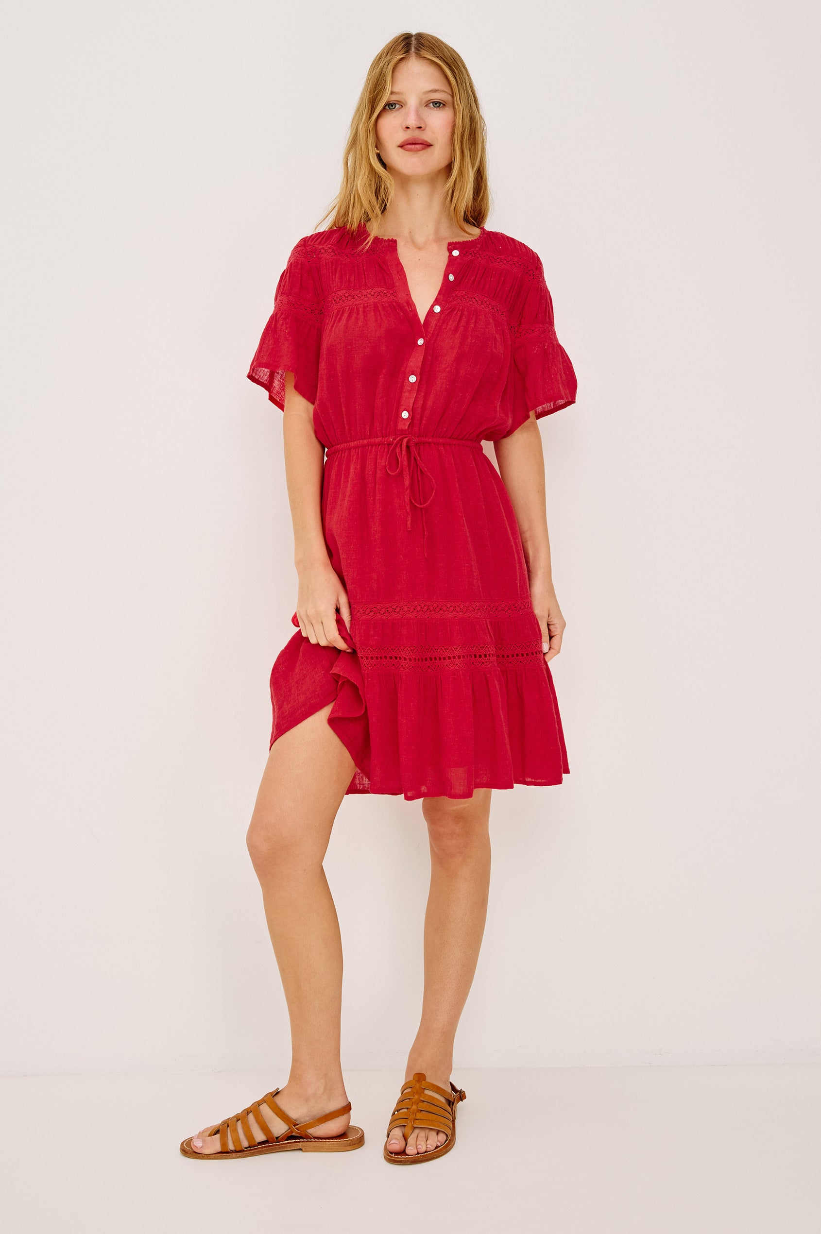 Winslow Mini Dress in Luxe Linen With Loose Fit, Lace Insets, Partial Button Front, Adjustable Drawstring Waist Ties, and a Fully Lined Skirt in Tomato Colorway - Full Body Front View Featured on Model