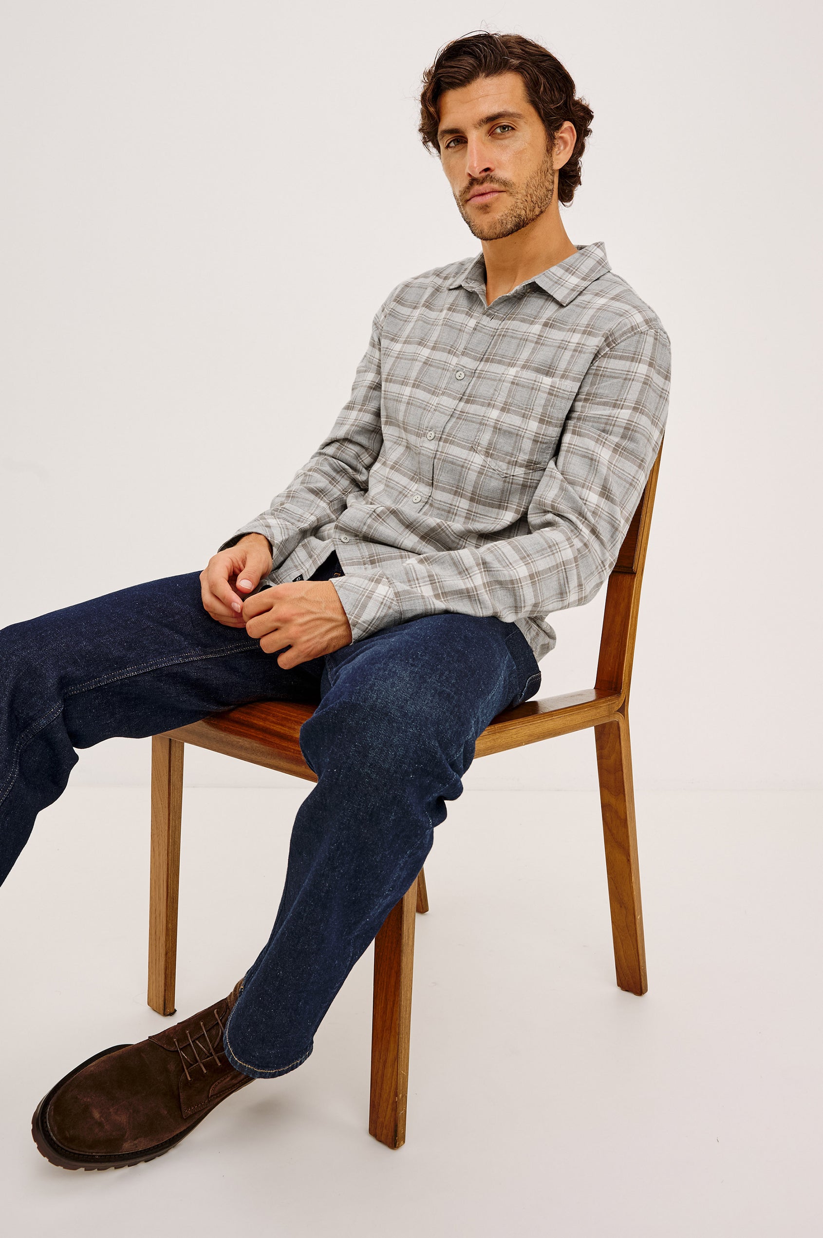 Wyatt Shirt in Cotton Slub Plainweave With Classic Fit, Collar, Button Front, Chest Patch Pocket, Long Sleeves, Shirttail Hem in Live Edge Heather Colorway - Full Body Front View Featured on Model Sitting