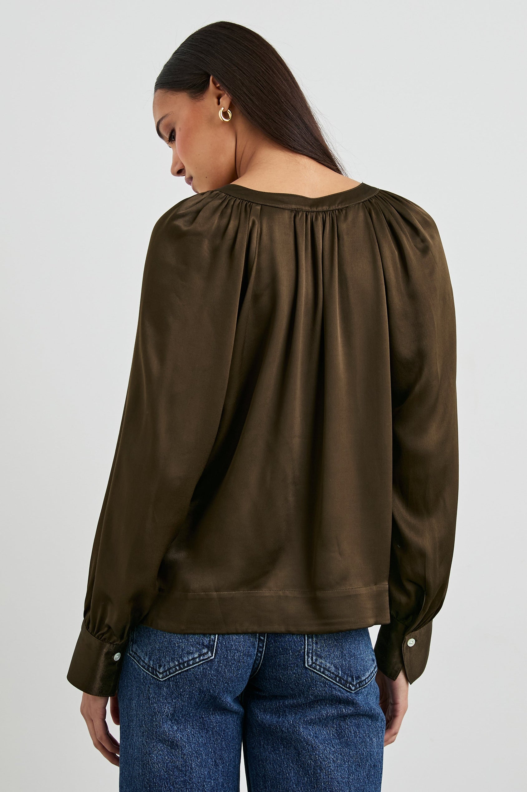 Wynna Long-Sleeve Top with a Deep V Neck and Ruching above the Cuffs and at the Neckline in Dark Moss Colorway - Back View Featured on Model