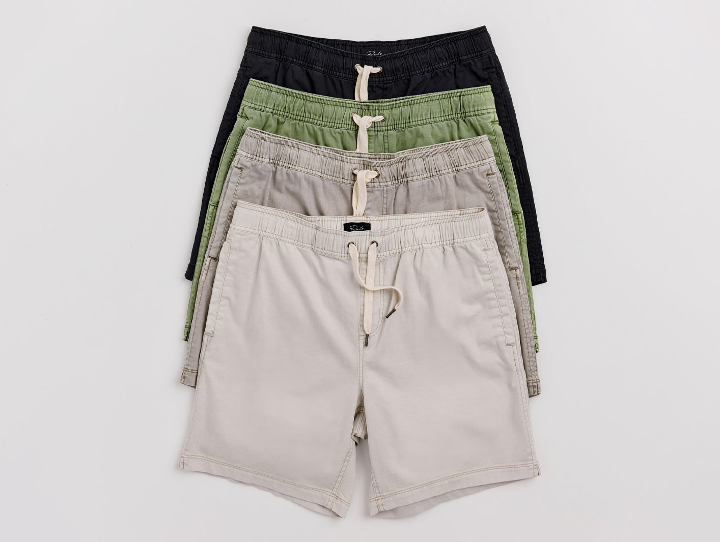 4 pairs of different colored shorts on a white background
