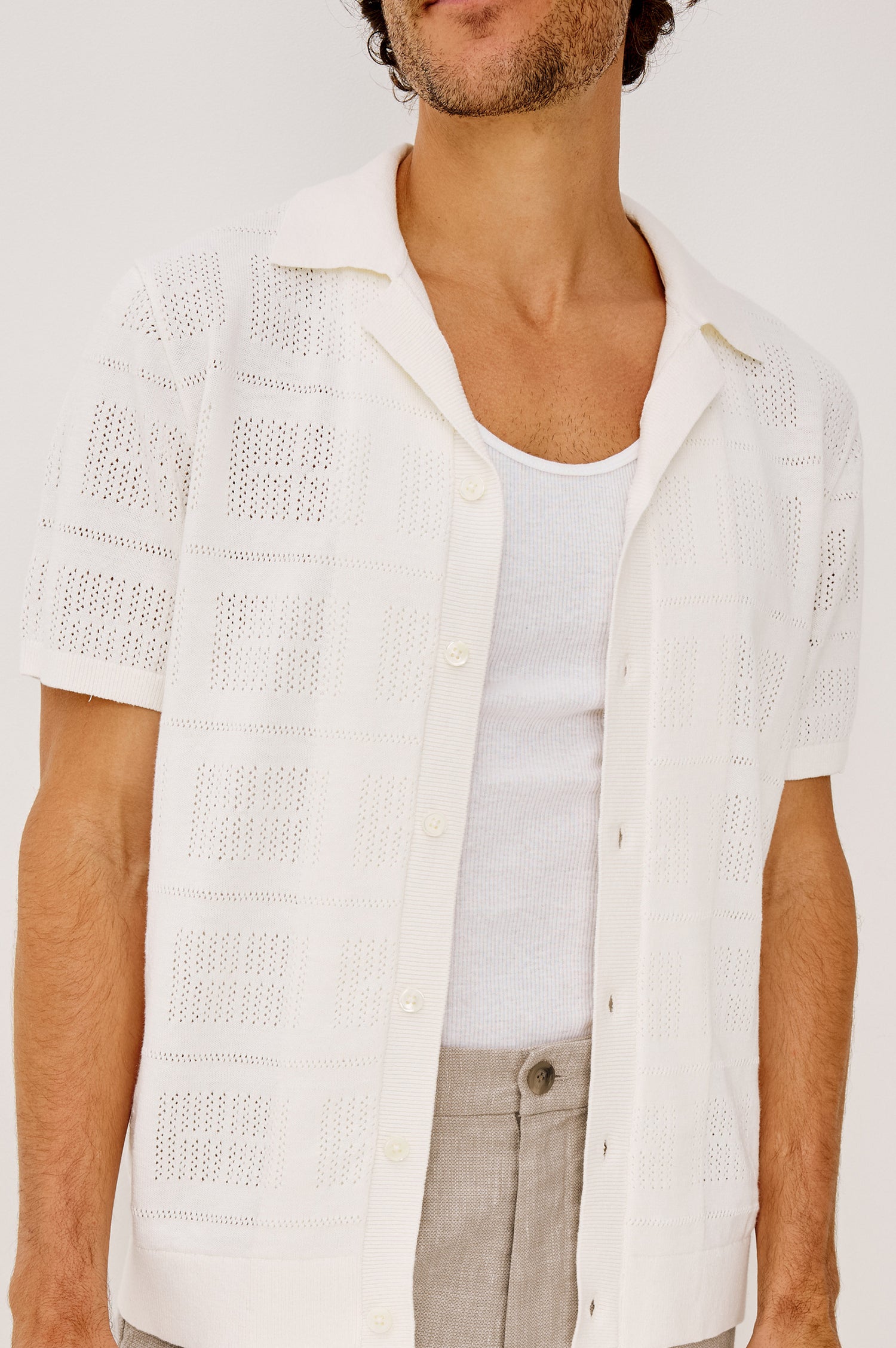 Yates Camp Shirt in Jacquard Knit With Open Collar, Short Sleeves, Front Buttons, and Relaxed Fit in White Colorway - Upper Body Front View Featured on Model