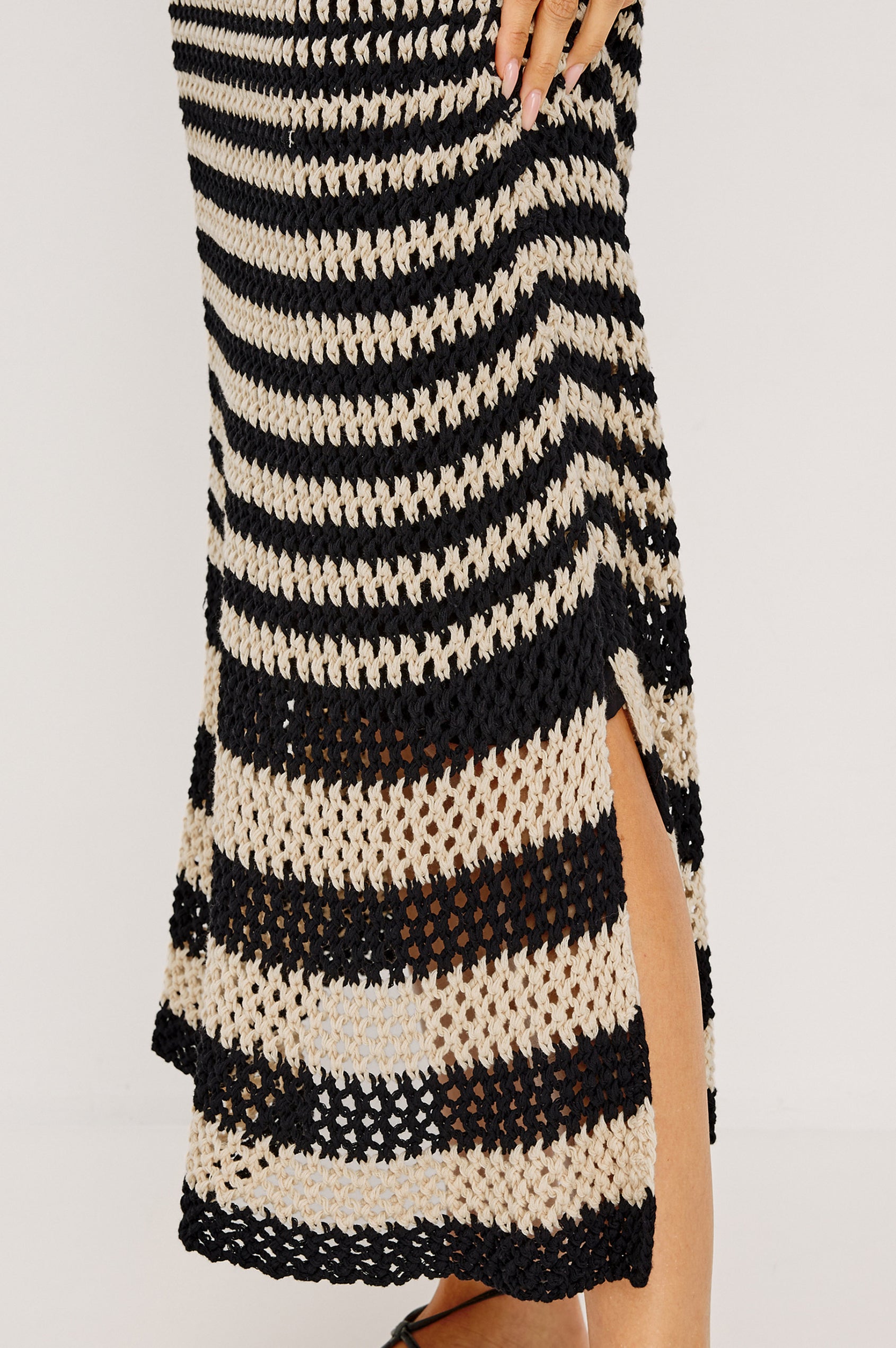 Yvette Maxi Dress in Cotton Knit With Scoop Neckline, Slightly Fitted at Top With A-Line Body, Side Slits, and Jersey Lining in Onyx Ivory Stripe Colorway - Lower Body Side Close Up View Featured on Model