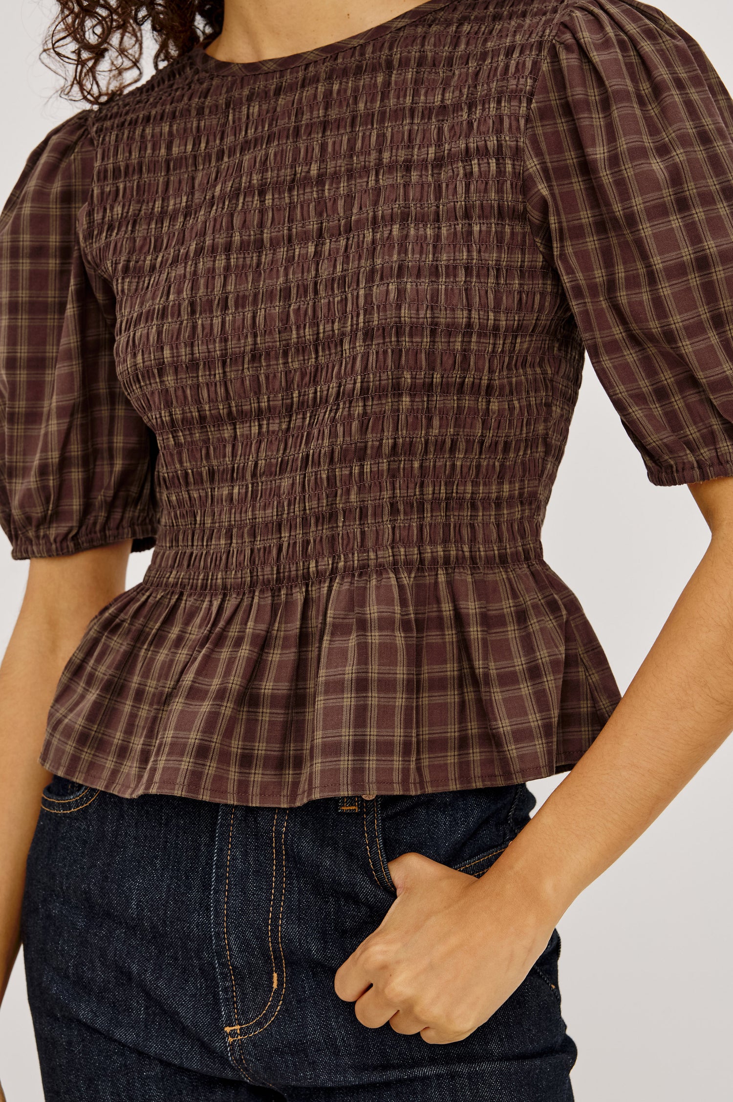 Zane Shirt in Brushed Cotton With Fitted Smocked Body, Elbow-Length Puff Sleeves With Elastic Cuffs, Adjustable Keyhole Tie at Back, and Peplum Hem in Espresso Olive Colorway - Upper Body Front View Featured on Model