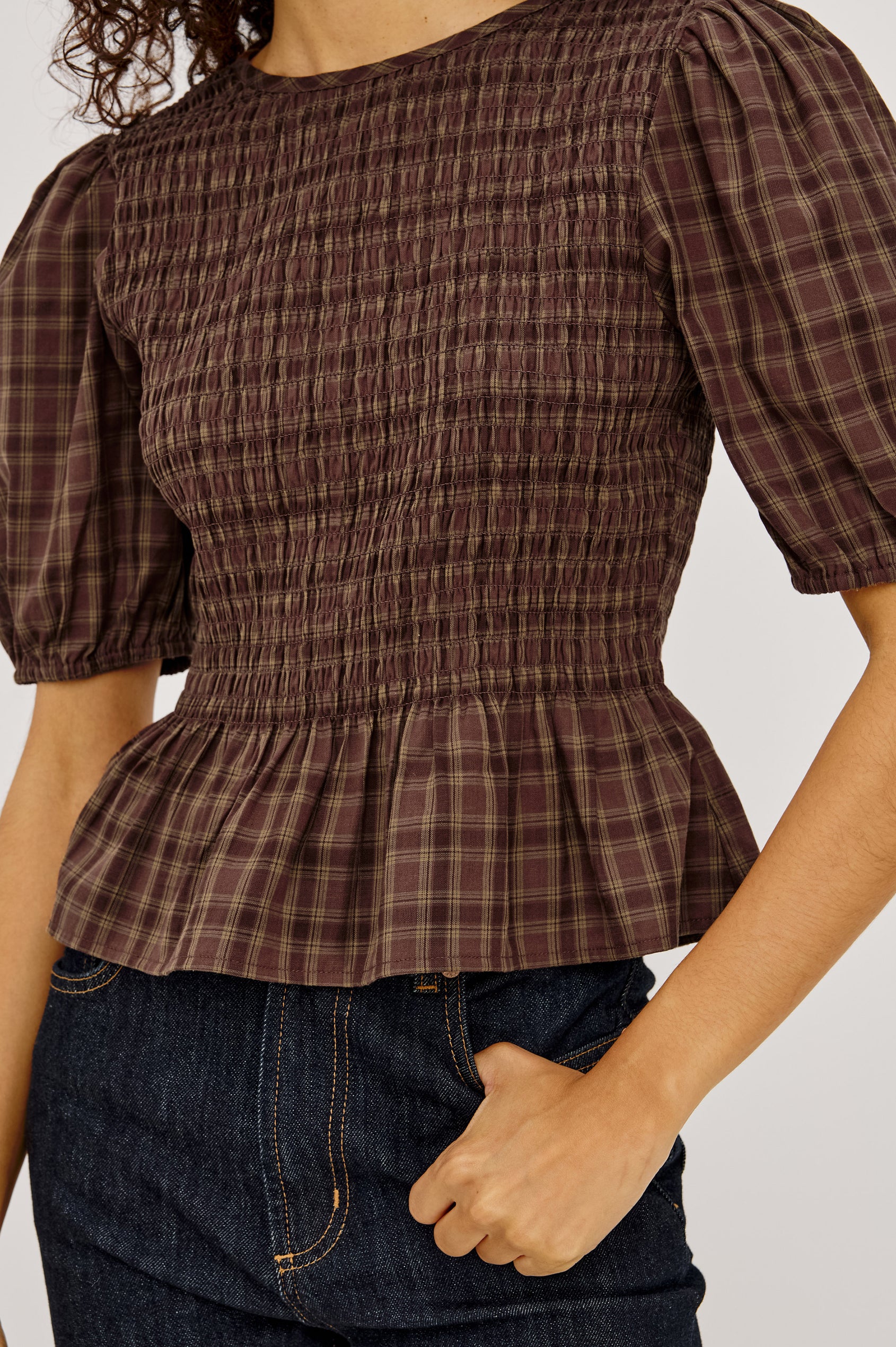 Zane Shirt in Brushed Cotton With Fitted Smocked Body, Elbow-Length Puff Sleeves With Elastic Cuffs, Adjustable Keyhole Tie at Back, and Peplum Hem in Espresso Olive Colorway - Upper Body Front View Featured on Model