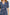 Zariah Midi Dress with Mid-Length Sleeves with Light Ruching, a Deep V Neck and an Empire Waist in Navy Flora Colorway, flowers in orange and blues on Navy - Front View Featured on Model