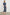 Zariah Midi Dress with Mid-Length Sleeves with Light Ruching, a Deep V Neck and an Empire Waist in Navy Flora Colorway, flowers in orange and blues on Navy - Back Full Body View Featured on Model