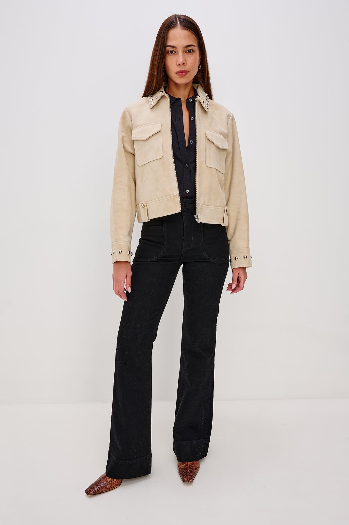 Zeta Boxy Moto Jacket in Suede With Metallic Studs, Collar, Front Zip Closure, Chest Flap Pockets, and Long Sleeves in Taupe Colorway - Full Body Front View Featured on Model