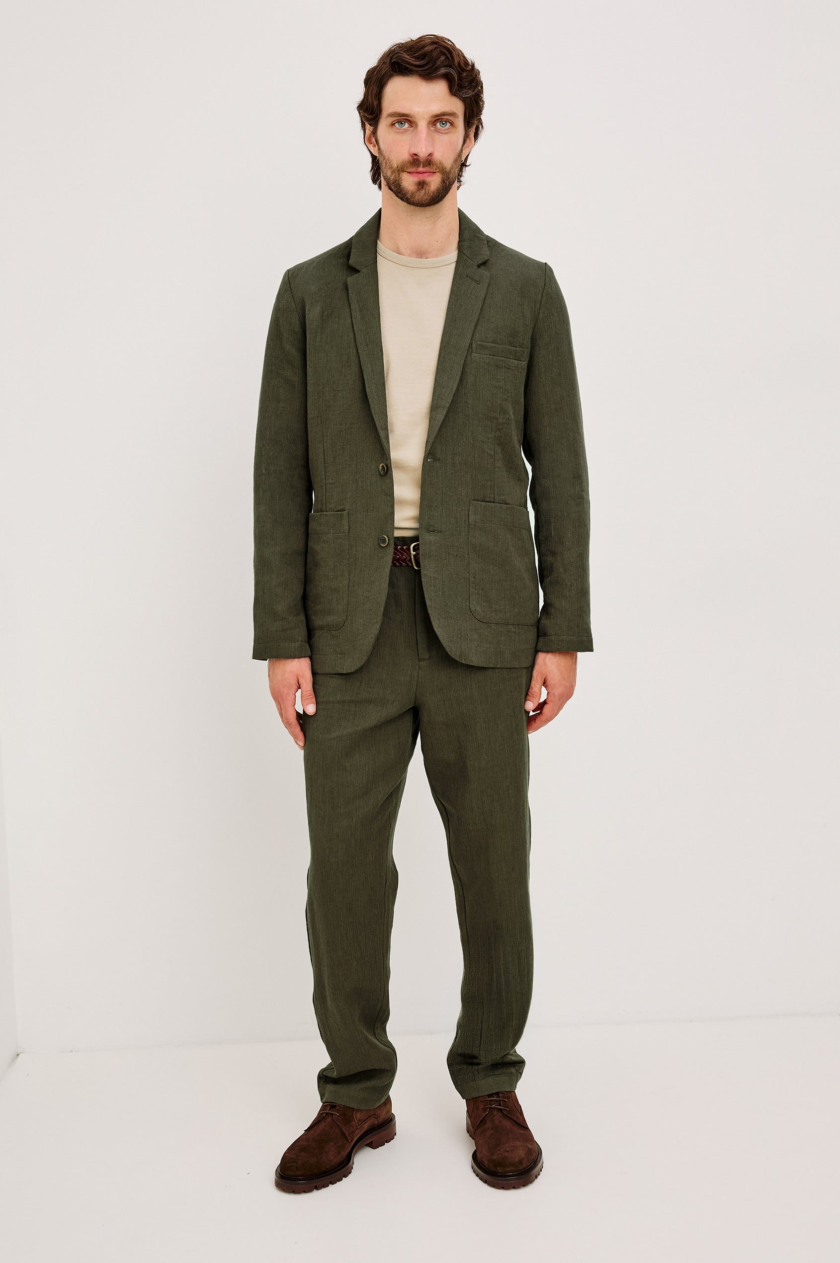 Zimmer Pant in Cotton Linen Wool Blend With Relaxed Fit, Tapered Leg, Side Pockets, Zip Fly, Belt Loops, and Back Welt Pockets in Deep Olive Colorway - Full Body Front View Featured on Model