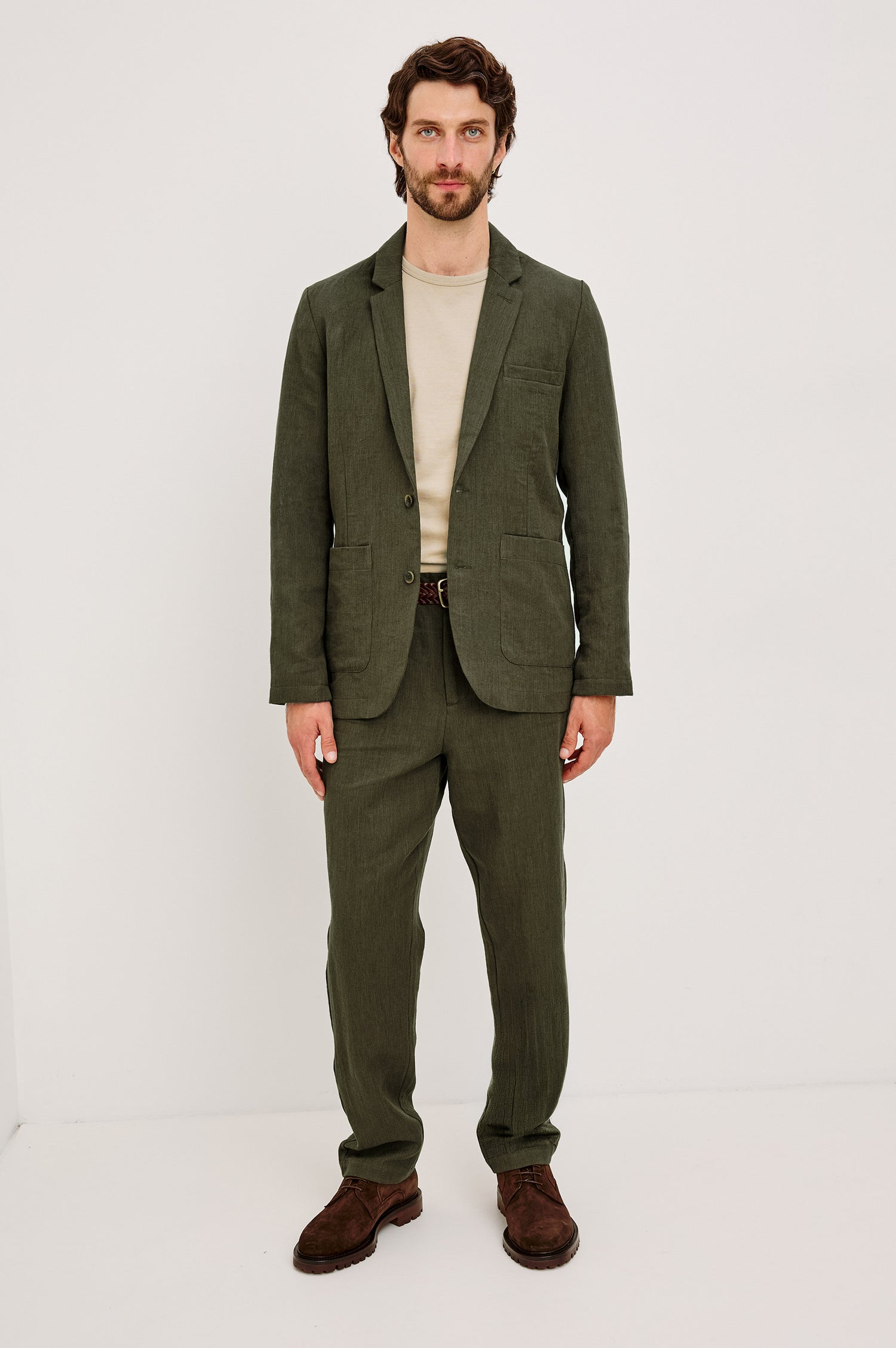 Zimmer Pant in Cotton Linen Wool Blend With Relaxed Fit, Tapered Leg, Side Pockets, Zip Fly, Belt Loops, and Back Welt Pockets in Deep Olive Colorway - Full Body Front View Featured on Model