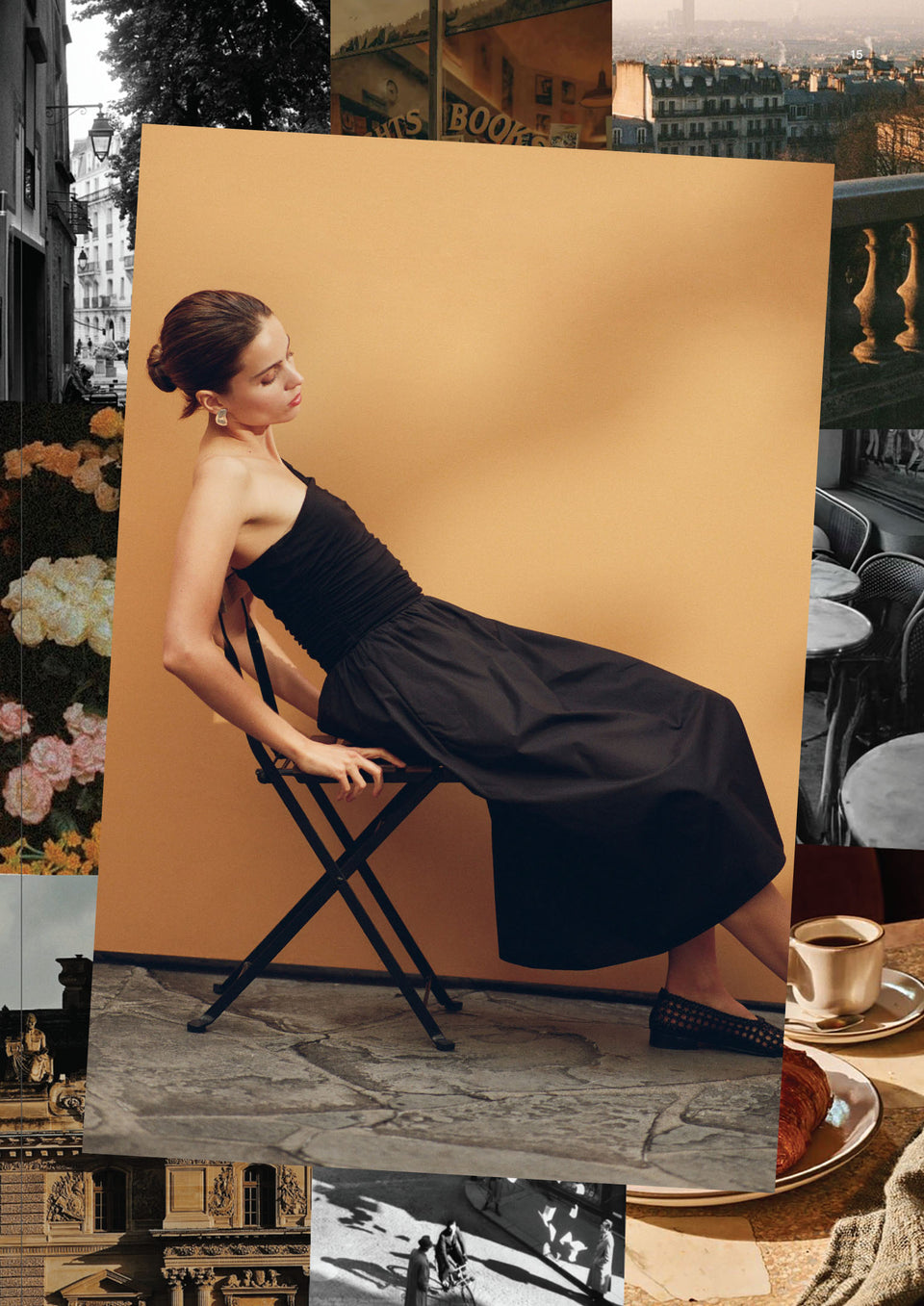 Woman in a black dress sitting on a stool against an orange backdrop.