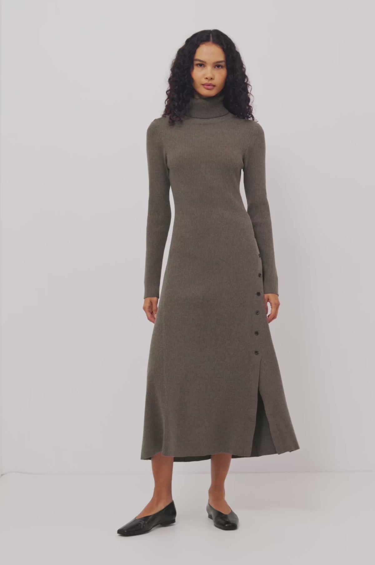 Kat Maxi Dress in Ribbed Cotton Blend With Foldover Turtleneck Button Neckline, Long Sleeves, Fitted Silhouette, Long Sleeves, Side Placket, and Subtle Flare at Hem in Hazelnut Colorway - Video - Full Body Front View Featured on Model