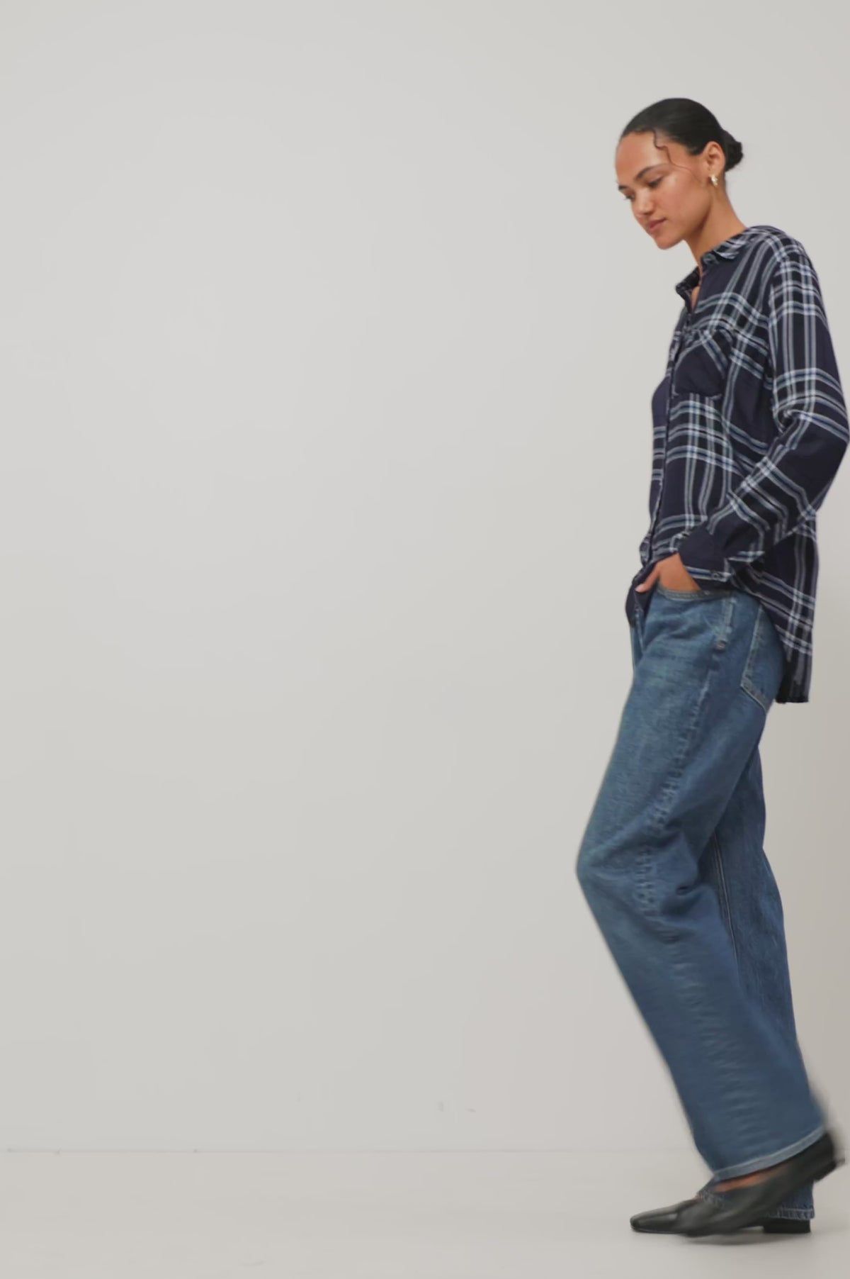 Hunter Shirt Plaid Button-Up With Relaxed Fit, Spread Collar, Chest Pocket, Long Sleeves, and Curved Hem in Indigo Sky Colorway - Front Crop View Featured on Model Moving (Video).