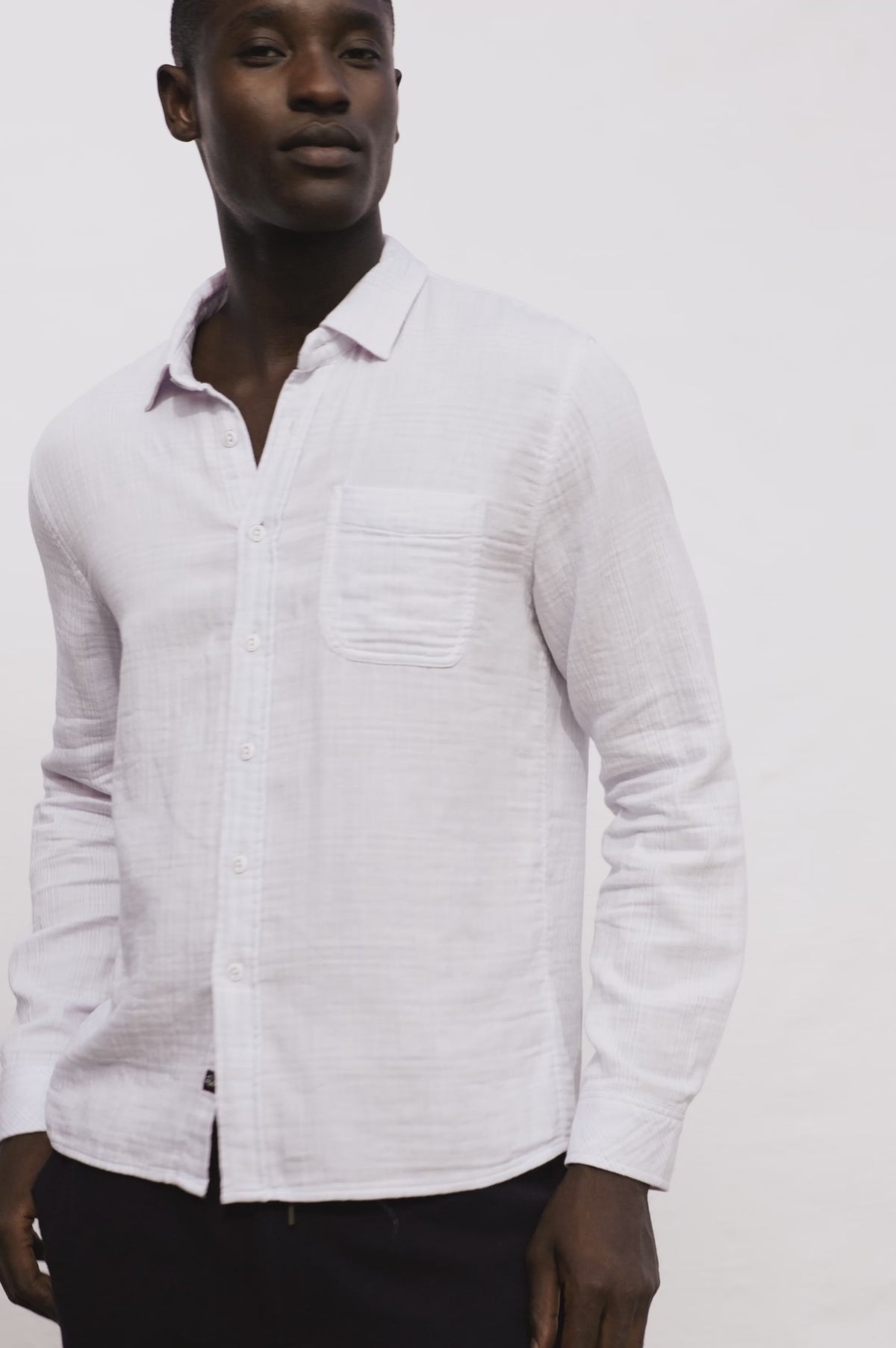 Owens Button-Up Shirt in Lightweight Cotton With Subtle Texture, Collar, Long Sleeves, and Chest Patch Pocket in Coastal Mist Colorway - Video - Upper Body Front View Featured on Model