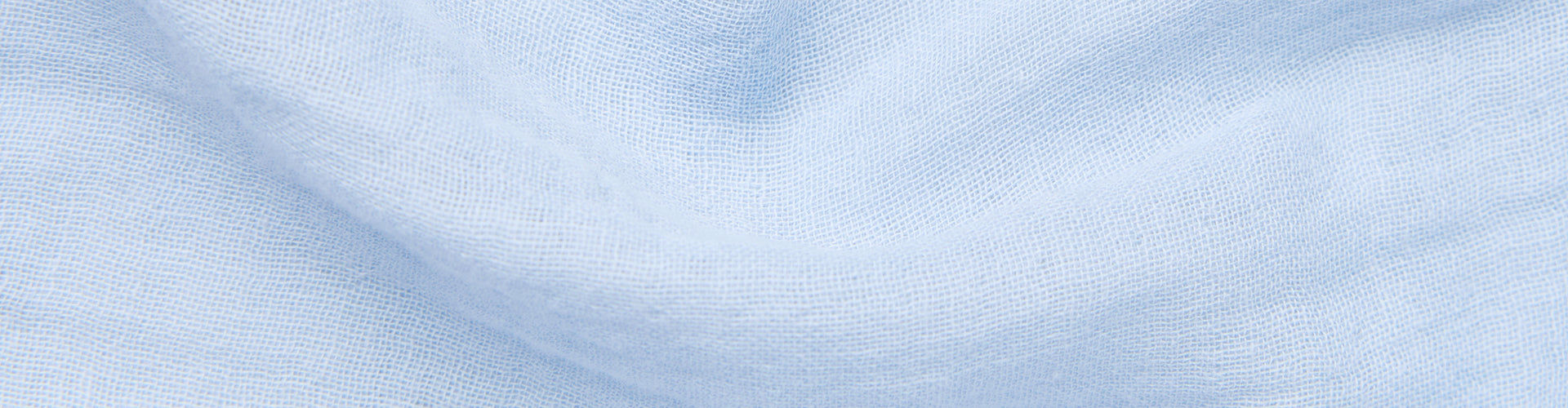 Close-up of light blue gauze fabric texture