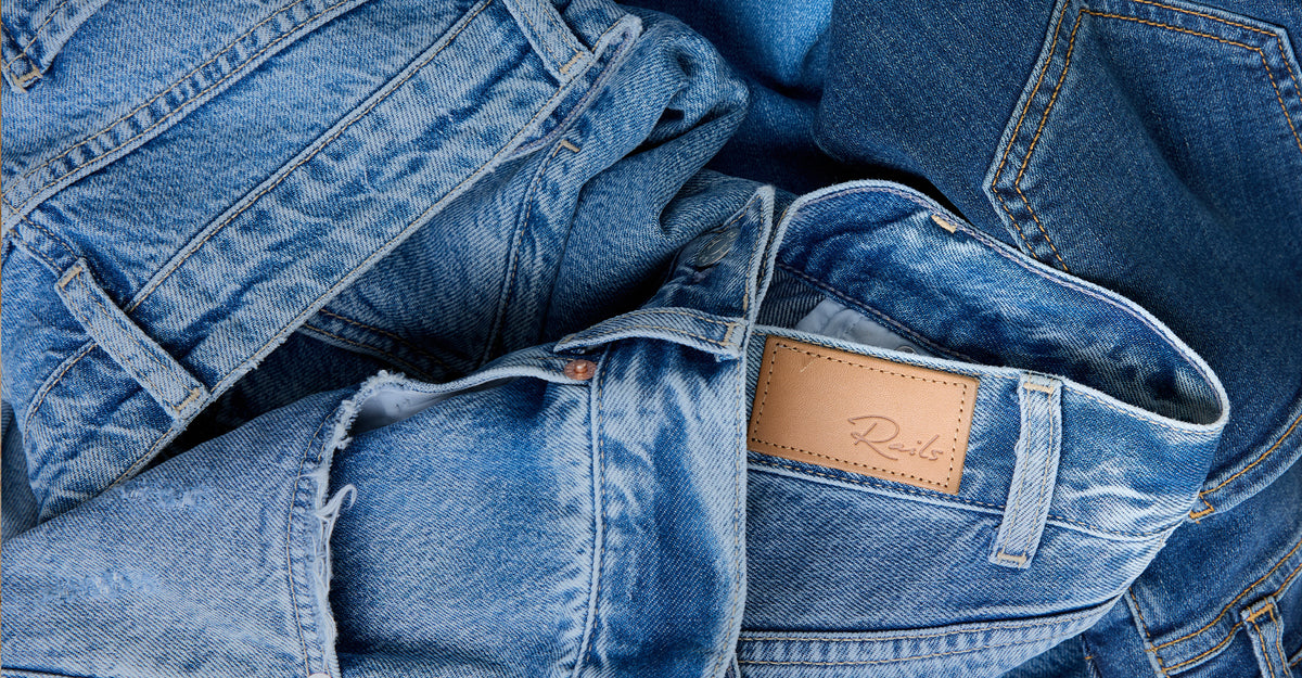 Close-up of blue denim jeans with a leather label.